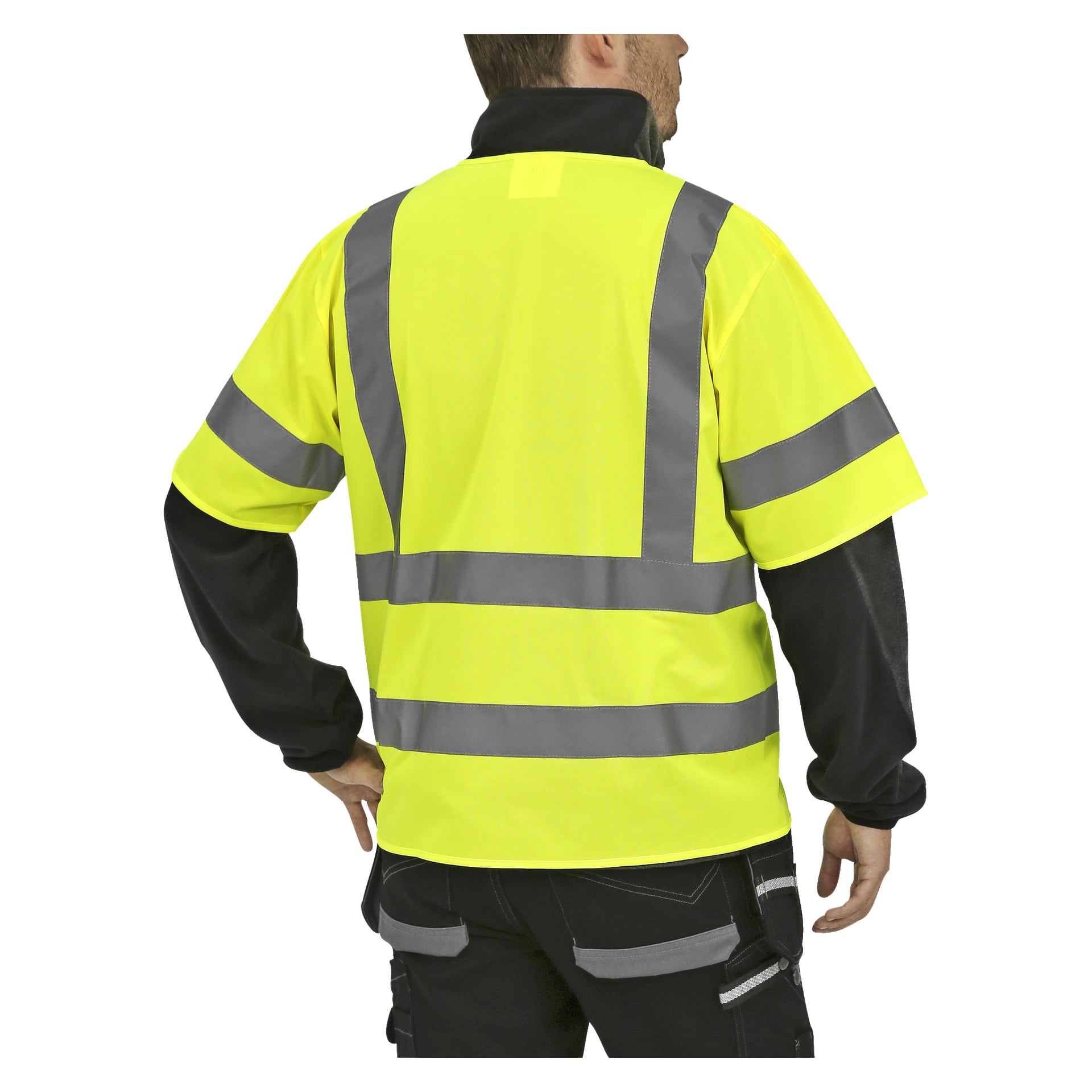 En person syns bakifrån, klädd i en ljusgul Bluewear Reflective Vest med grå reflekterande ränder, tillsammans med svarta byxor med reflekterande detaljer.