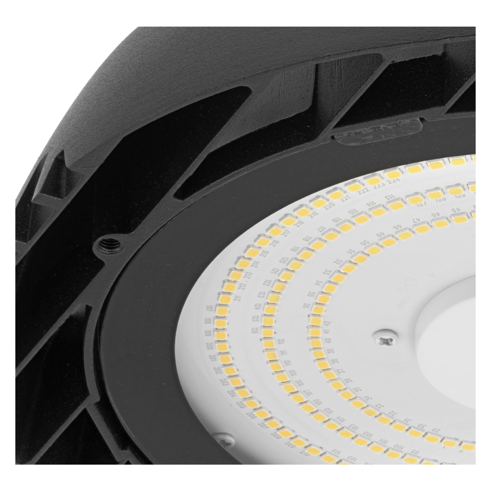 Detaljerad vy av Anslut Industrial LED-armaturen, som visar flera små gula LED-lampor i cirkulära mönster inuti ett svart hölje.