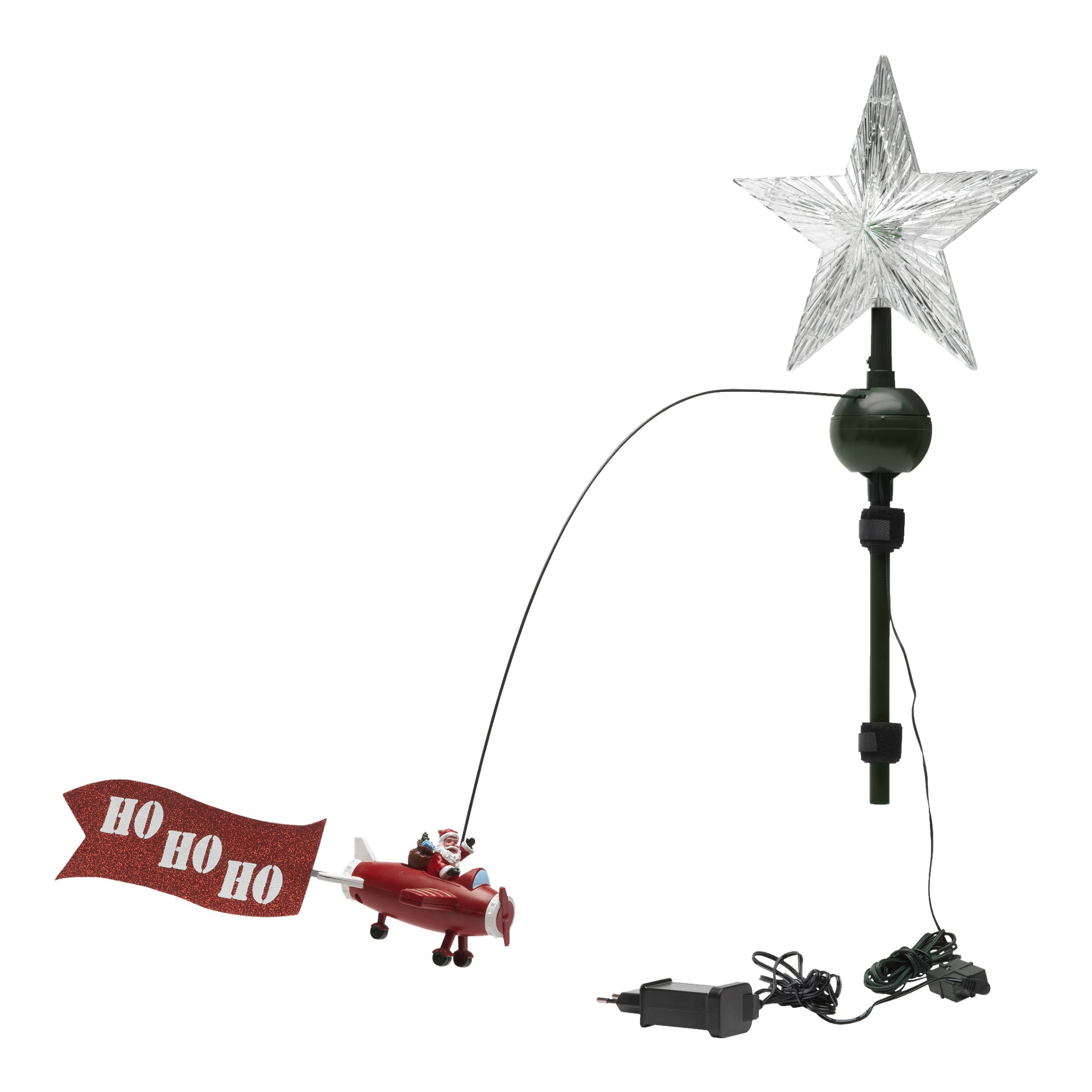 EKVIP Top Star z latającym Mikołajem to koronka drzewa z przezroczystą gwiazdą, miniaturowym Mikołajem pilotującym czerwony samolot oraz banerem "HO HO HO" ciągnącym się za nim. Z podstawy wystaje przewód elektryczny do zasilania.