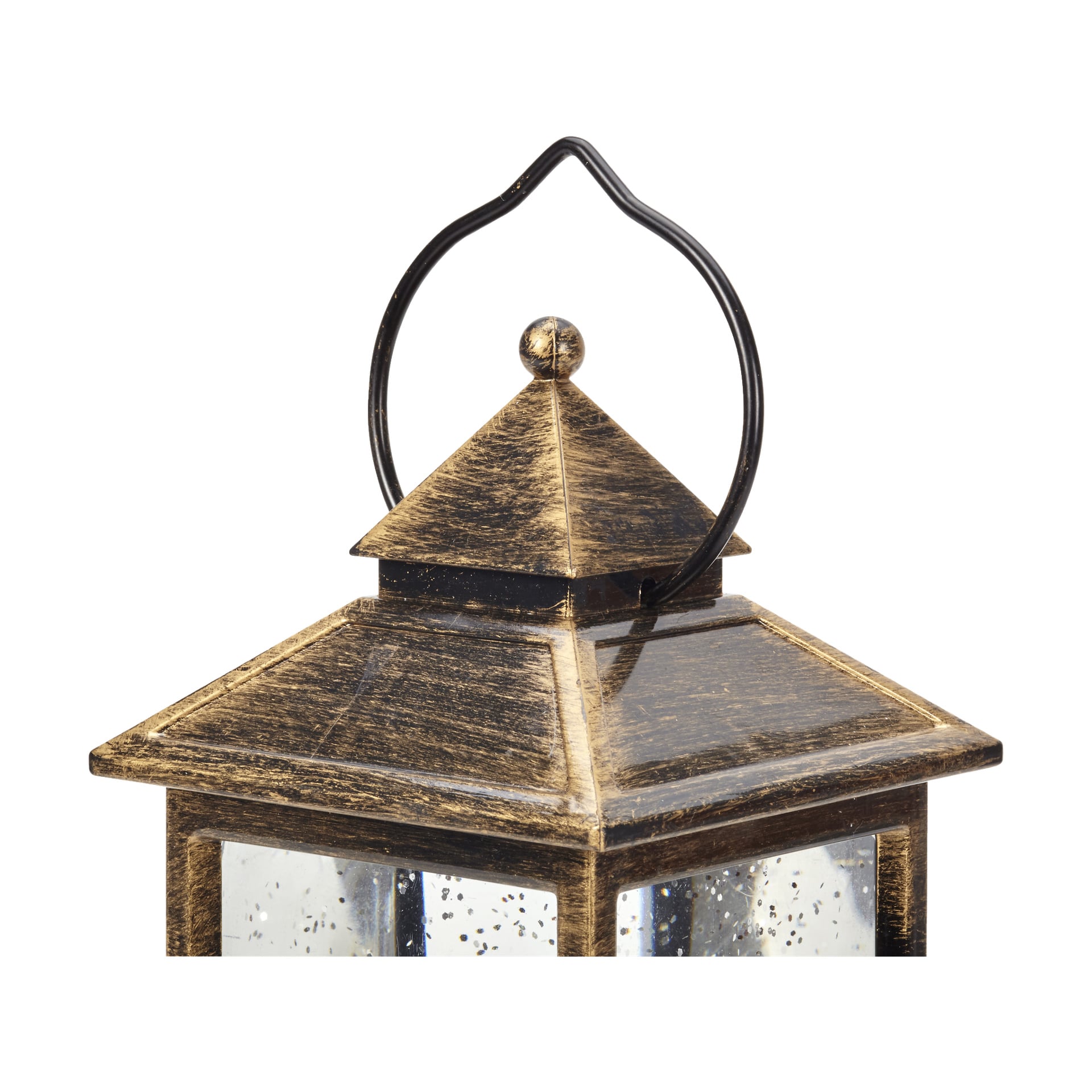 En närbild fångar den övre delen av EKVIP Luminous LED-tomtelampan, vilket framhäver dess väderbitna bronsfinish, klara glaspaneler, skarpt spetsiga tak och svart metallhängkrok för ett tydligt vintage och rustikt utseende.