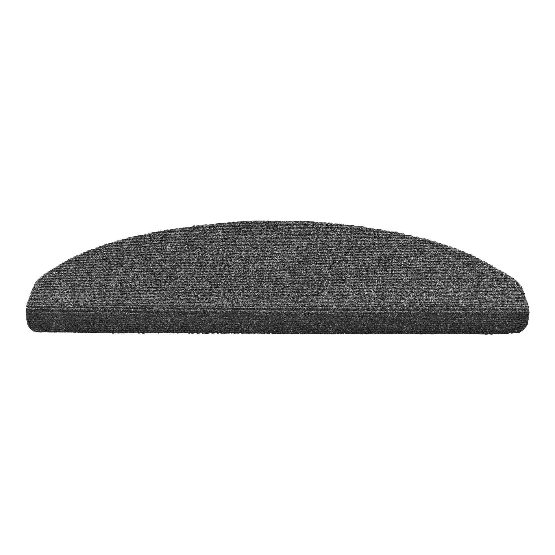 En mörkgrå EKVIP trappmatta med en texturerad, halvcirkelformad design och en tjockt lackerad nederkant.
