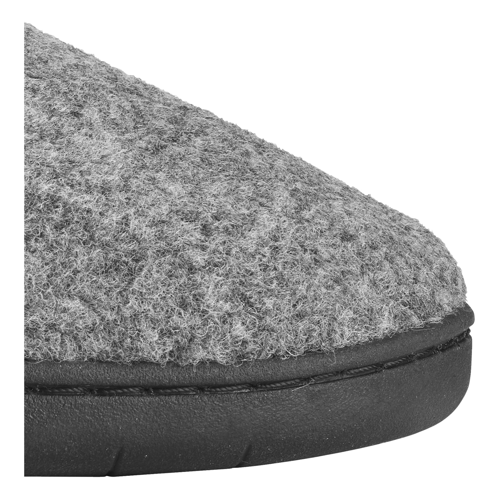 Närbild av framdelen på en Kayoba Outdoor Slipper gjord av grå filt, med en texturerad översida och en svart gummisula.