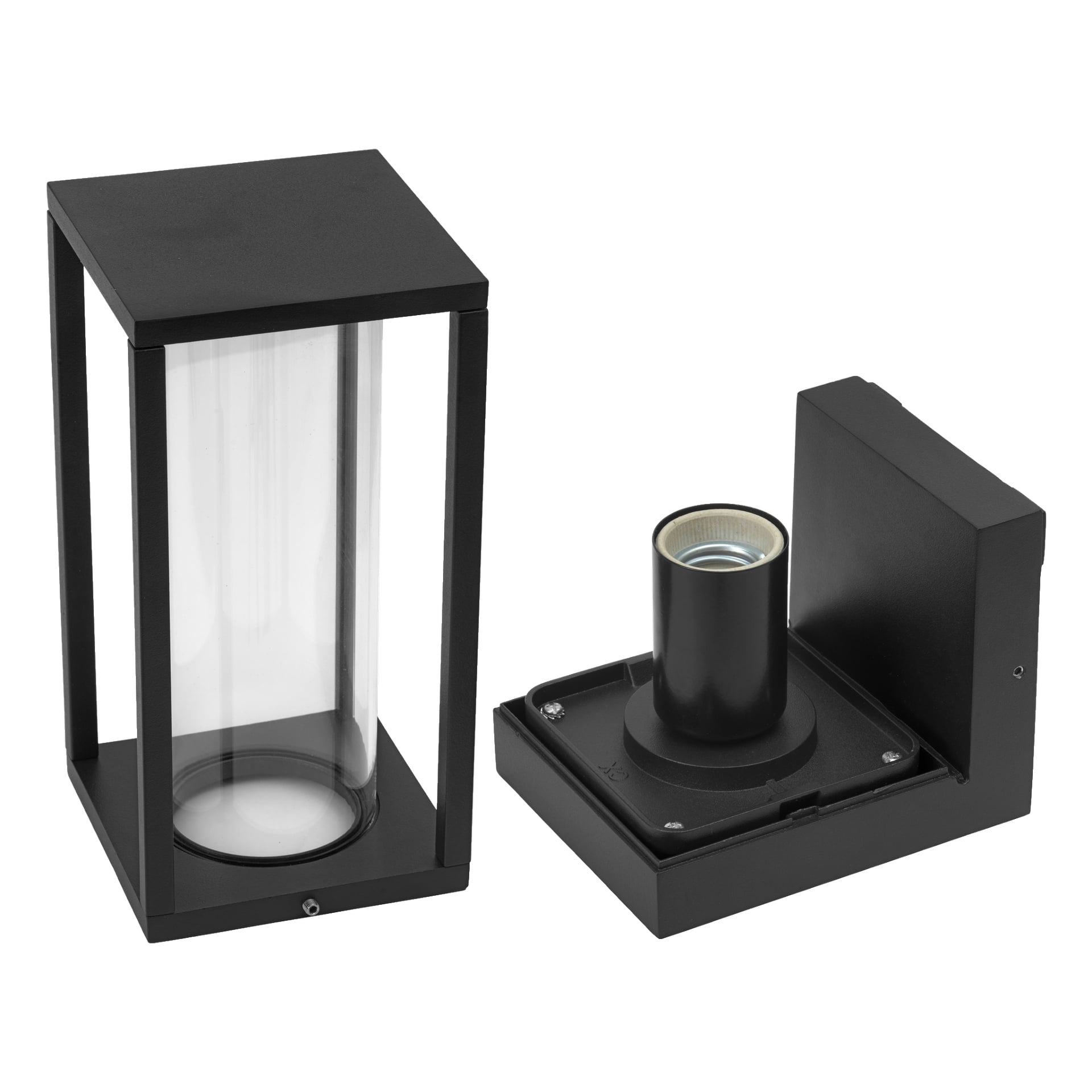 En svart EKVAP-vägglampa visas i två separata delar: en del är en rektangulär ram som håller klart cylindriskt glas, och den andra är basen med en synlig lampsockel.