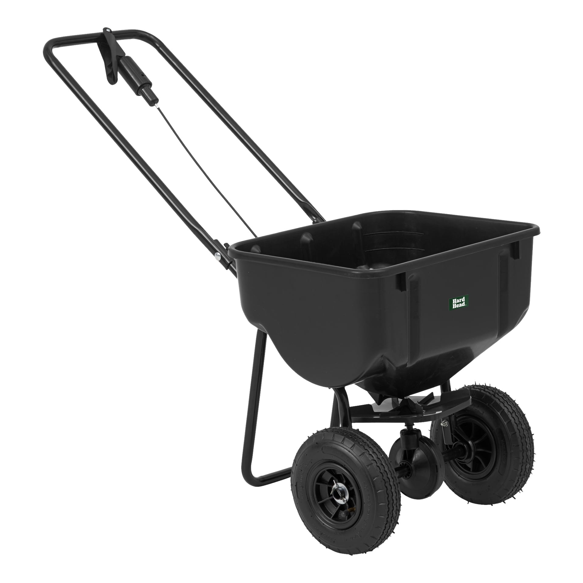 En svart tryckgrässpridare kallad Hard Head Spreader har två stora hjul, en rektangulär behållare och ett handtag, gjort för att sprida gödsel eller frön över gräsmattan.