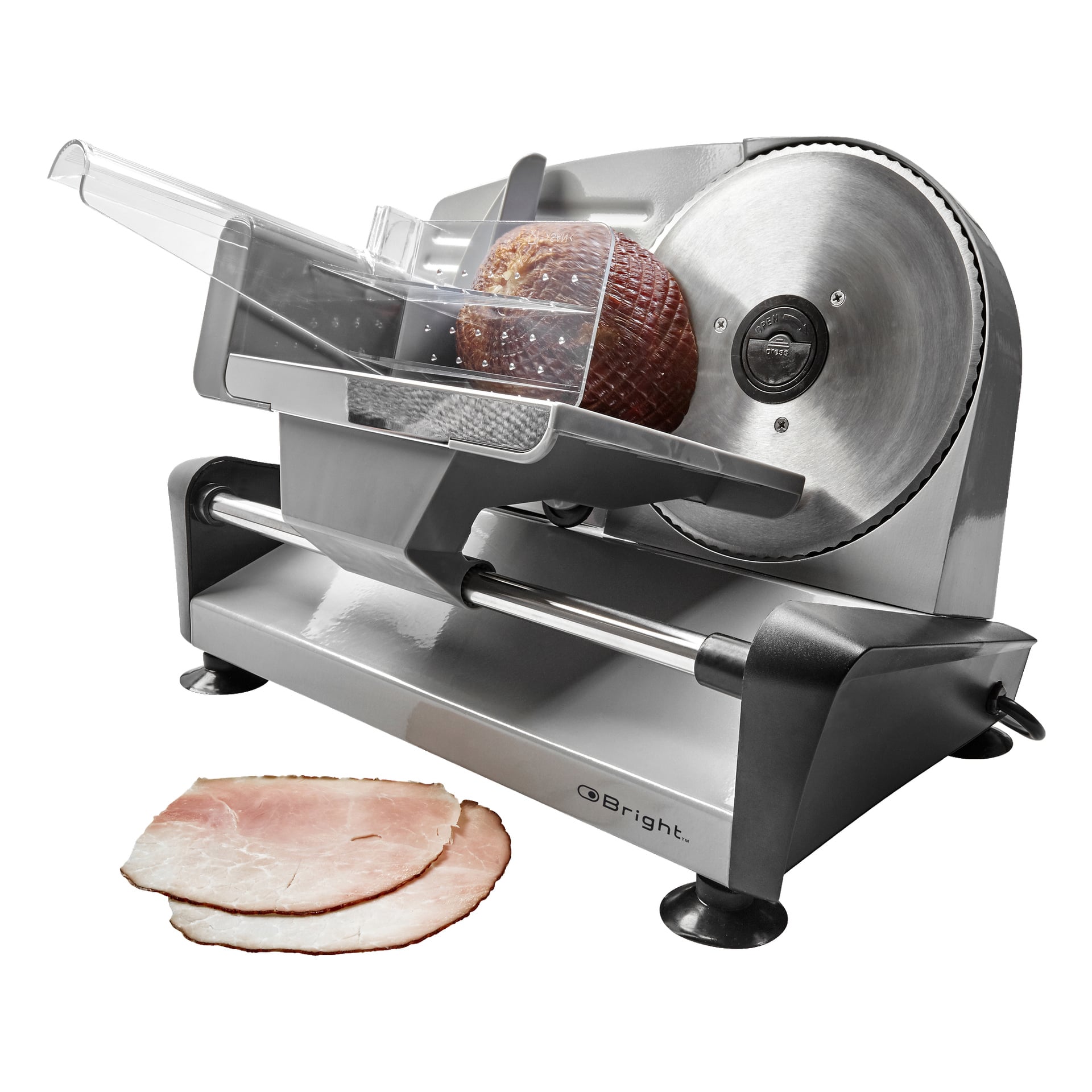 En Bright Slicer med ett cirkulärt blad skär en bit skinka, medan två skivor skinka vilar framför maskinen.