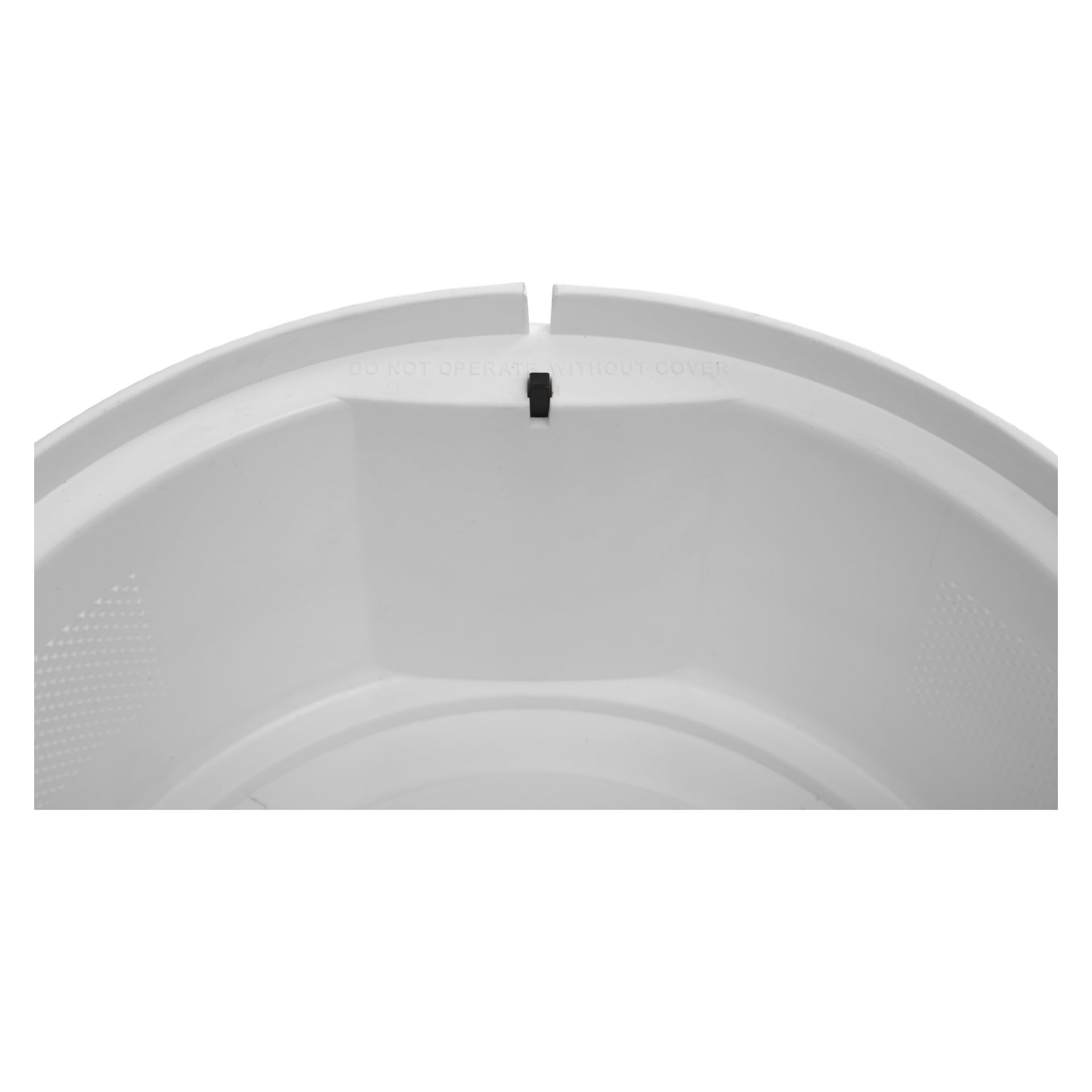 Närbild av interiören av en Bright Electric potatisskalare, med en liten svart rektangulär del placerad längs överkanten och svag varningstext som säger: "ANVÄND EJ UTAN SKYDD."
