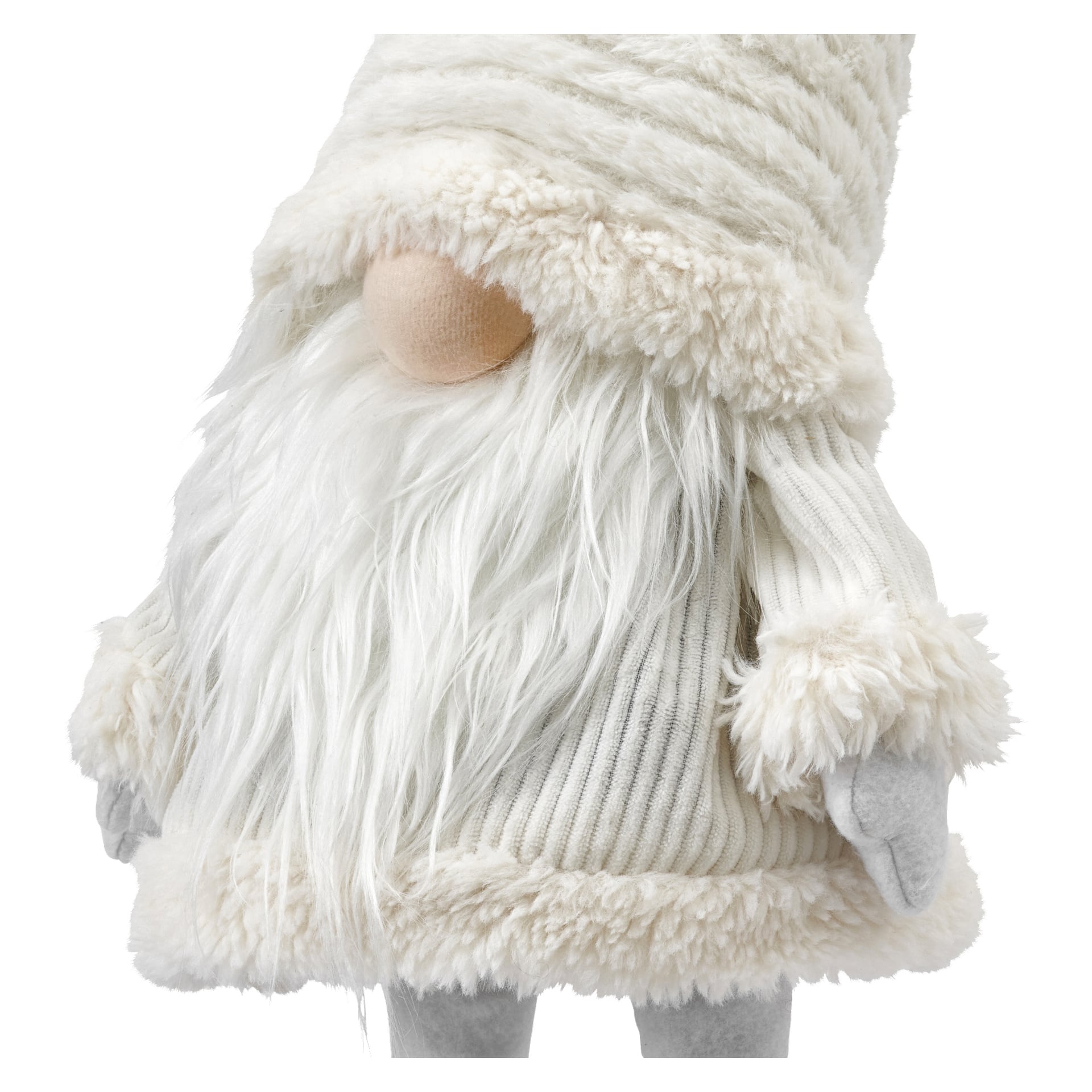 En närbild på EKVIP Wobbling Santa. Denna dekorativa figur har en beige tygnäsa, ett långt vitt fuskpälsskägg och är klädd i en vit stickad tröja och hatt kantad med mjuk päls. Händerna är täckta av grå vantar.