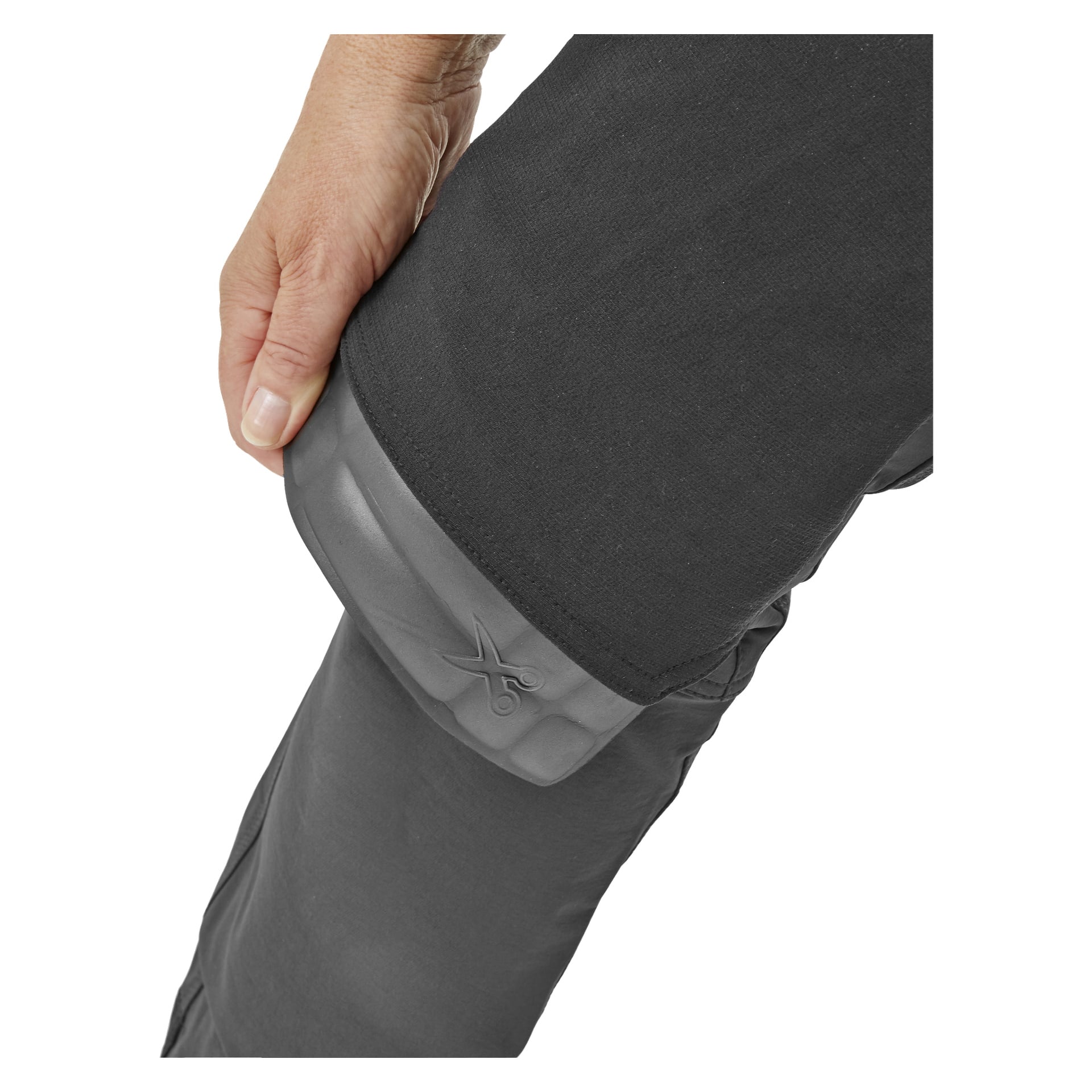 En person lyfter fållen på Bluewear Pro Workwear Women's work pants Stella och avslöjar en grå fläck med en saxikon och orden Cut Here visade.