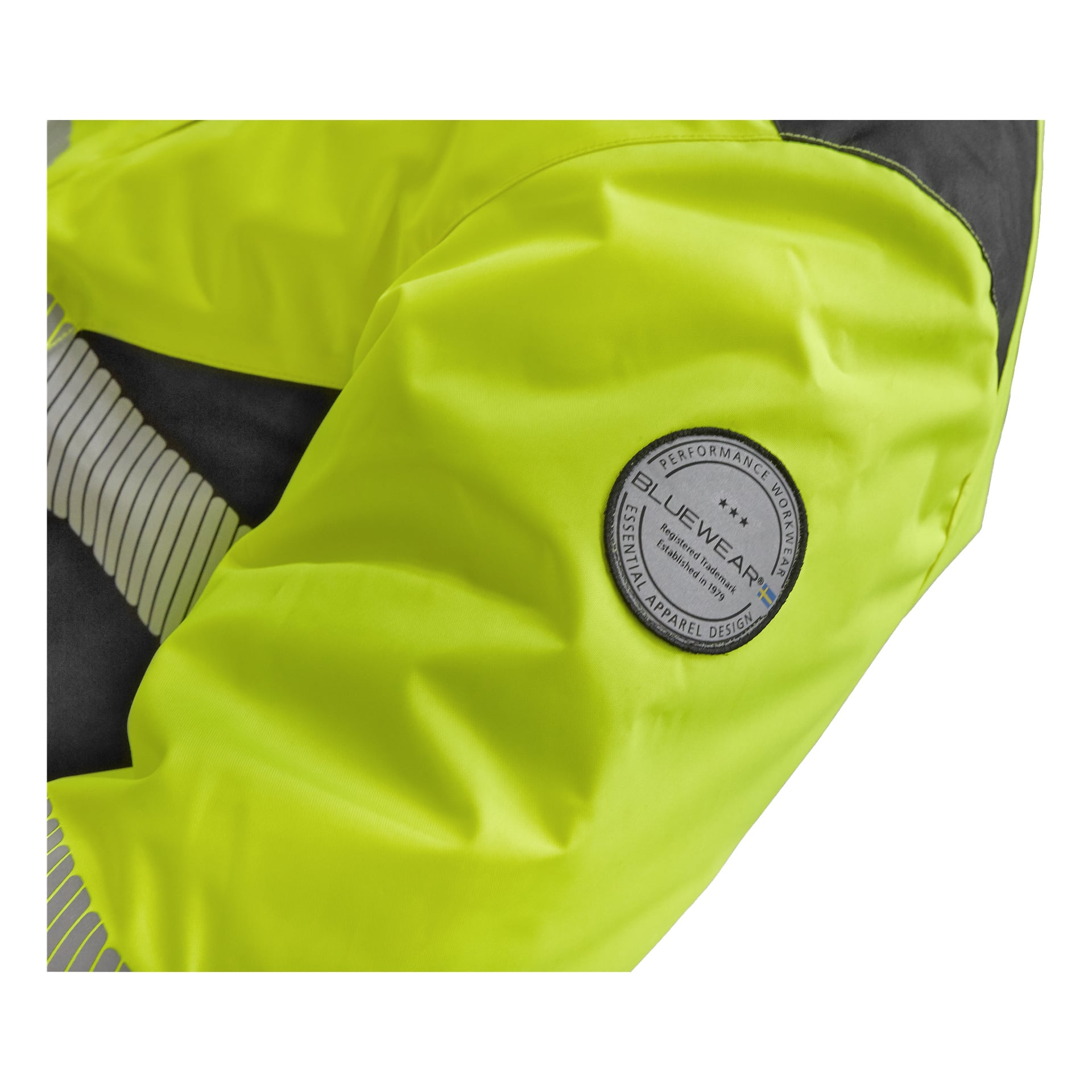 En närbild av den Warm fodrade Hi-Vis-jackan Hamilton från Bluewear framhäver en klargul ärm med en rund grå LIVEWEAR-patch och reflekterande sidoränder.