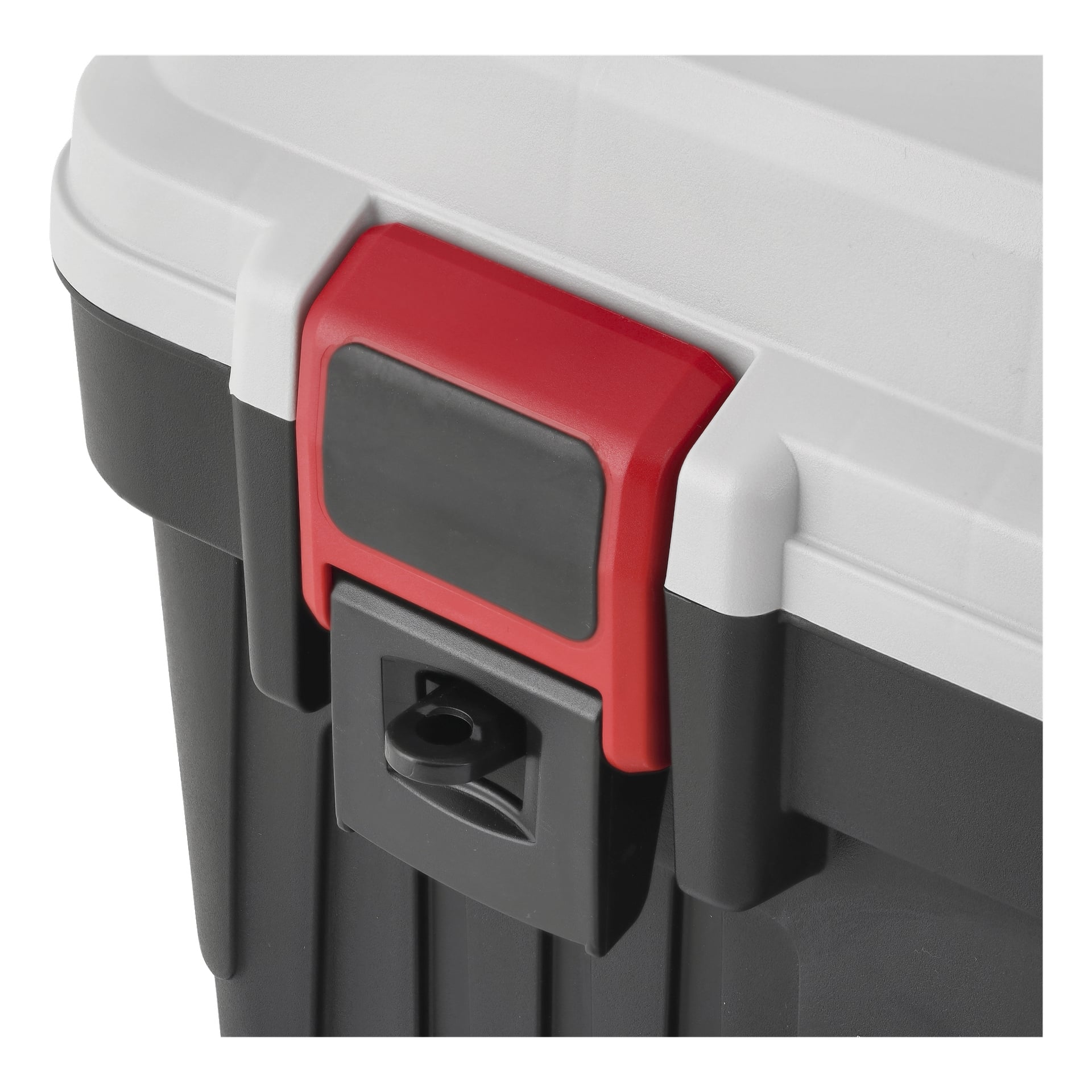 Detaljerad vy av ett hörn i Meec Tools Tool Box, som visar en röd och svart låsning på ett grått lock. Under låset finns ett nyckelhål för att låsa verktygslådan.