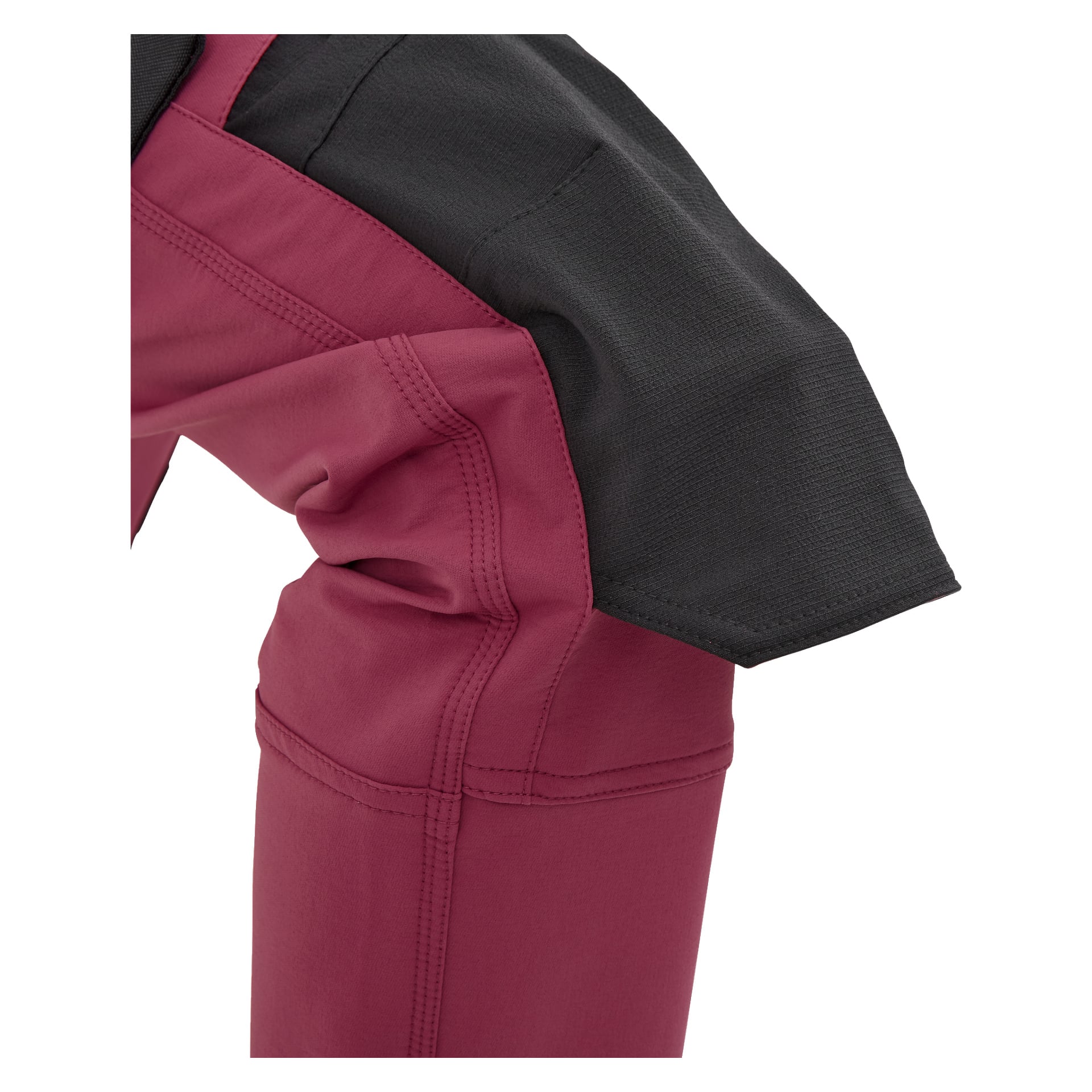 Ein Nahblick auf ein gebeugtes Knie, gekleidet in Bluewear Pro Workwear Stella Arbeitshosen in dunkelrosa Women's Stella, mit sichtbaren Nähten, einem schwarzen Kniepflaster und verstärktem Stoff am Gelenk.