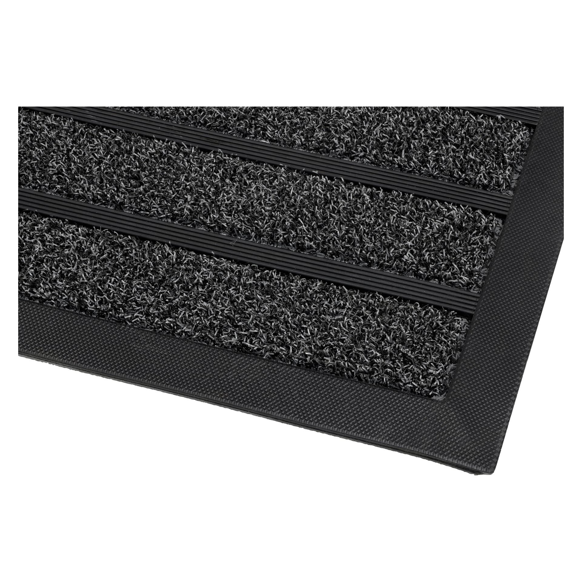 Närbild på EKVIP Doormat, en rektangulär svart matta med texturerade fibrer, räfflade gummiremsor och en gummikant.
