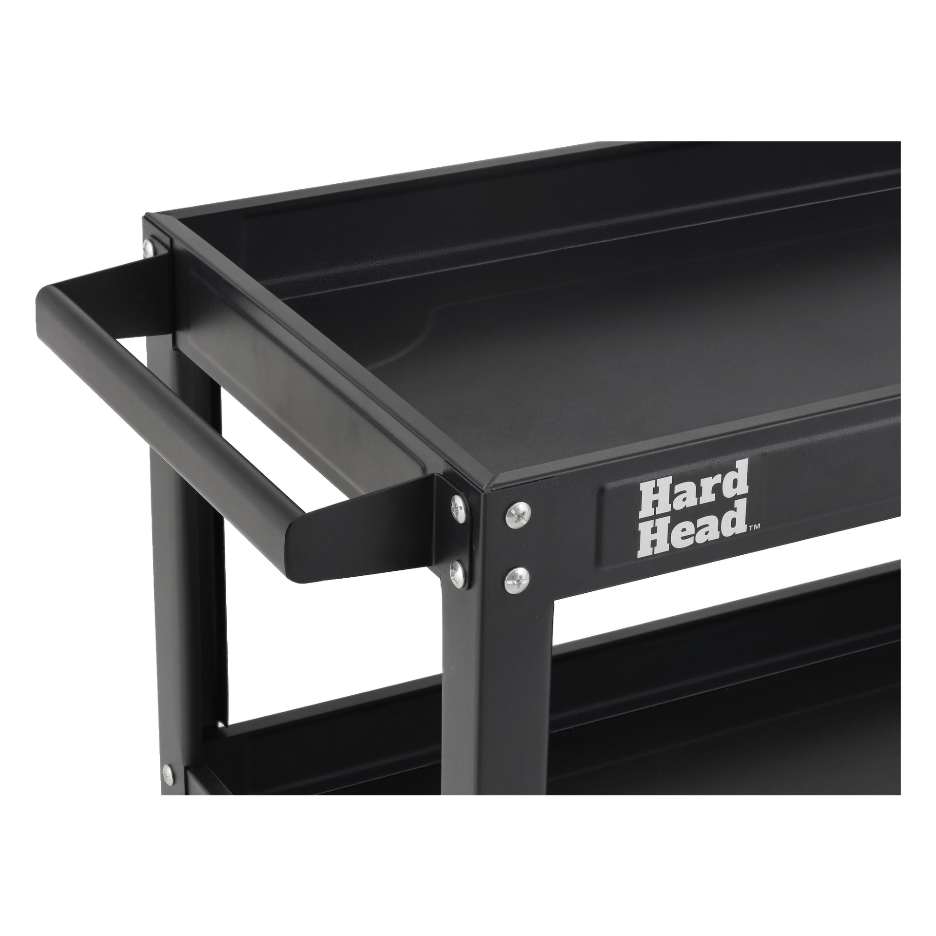 Et detaljert nærbilde viser det øverste hjørnet av en svart metall Hard Head-trolley med håndtaket og synlig merkenavn på siden. Designet fremhever den rektangulære rammen og de synlige boltene ved hver skjøt.