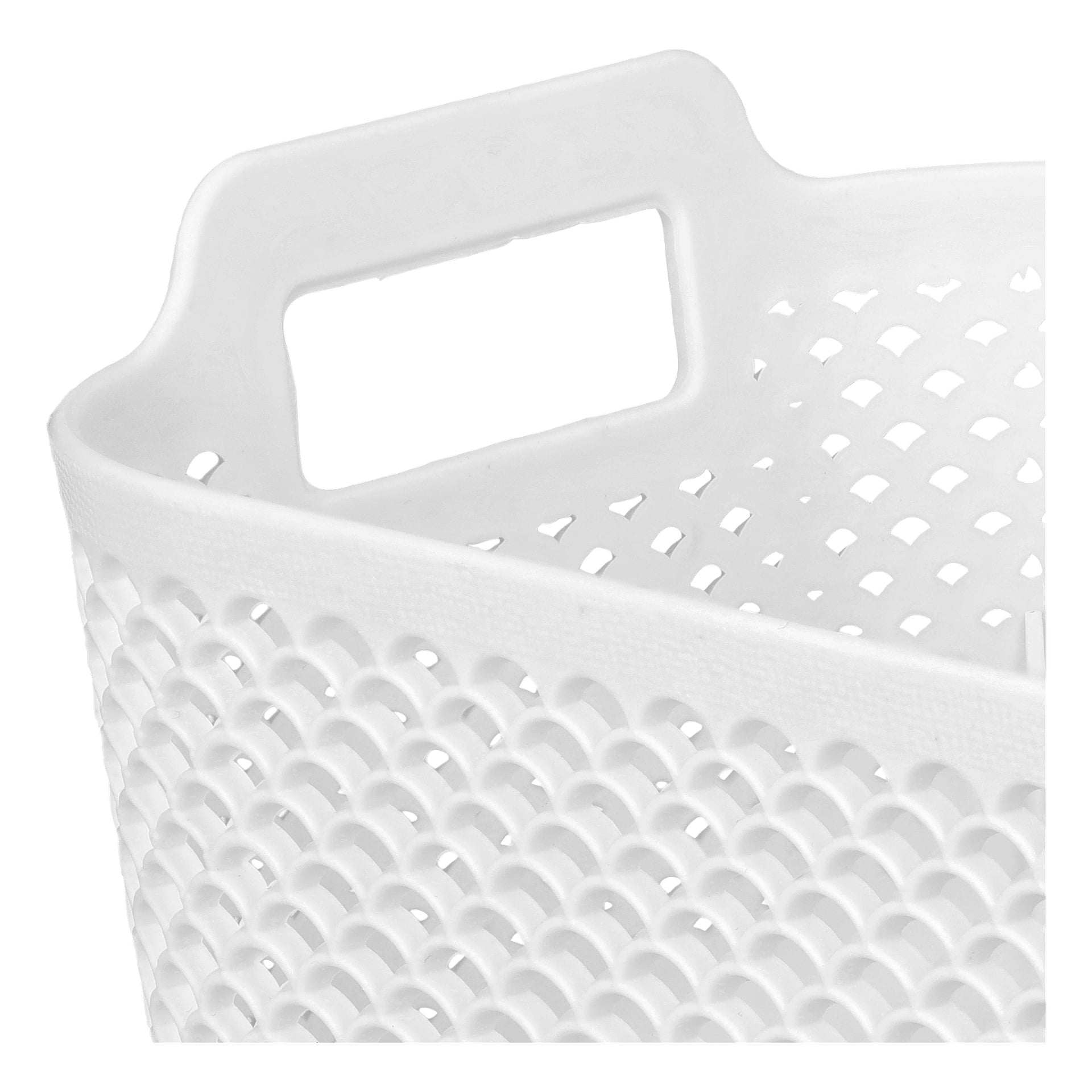 Et detaljert bilde av Hard Head Storage-kurven fremhever dens hvite plastkonstruksjon med et teksturert, skjellinspirert mønster og et rektangulært håndtak nær toppen. Kurven er tom.