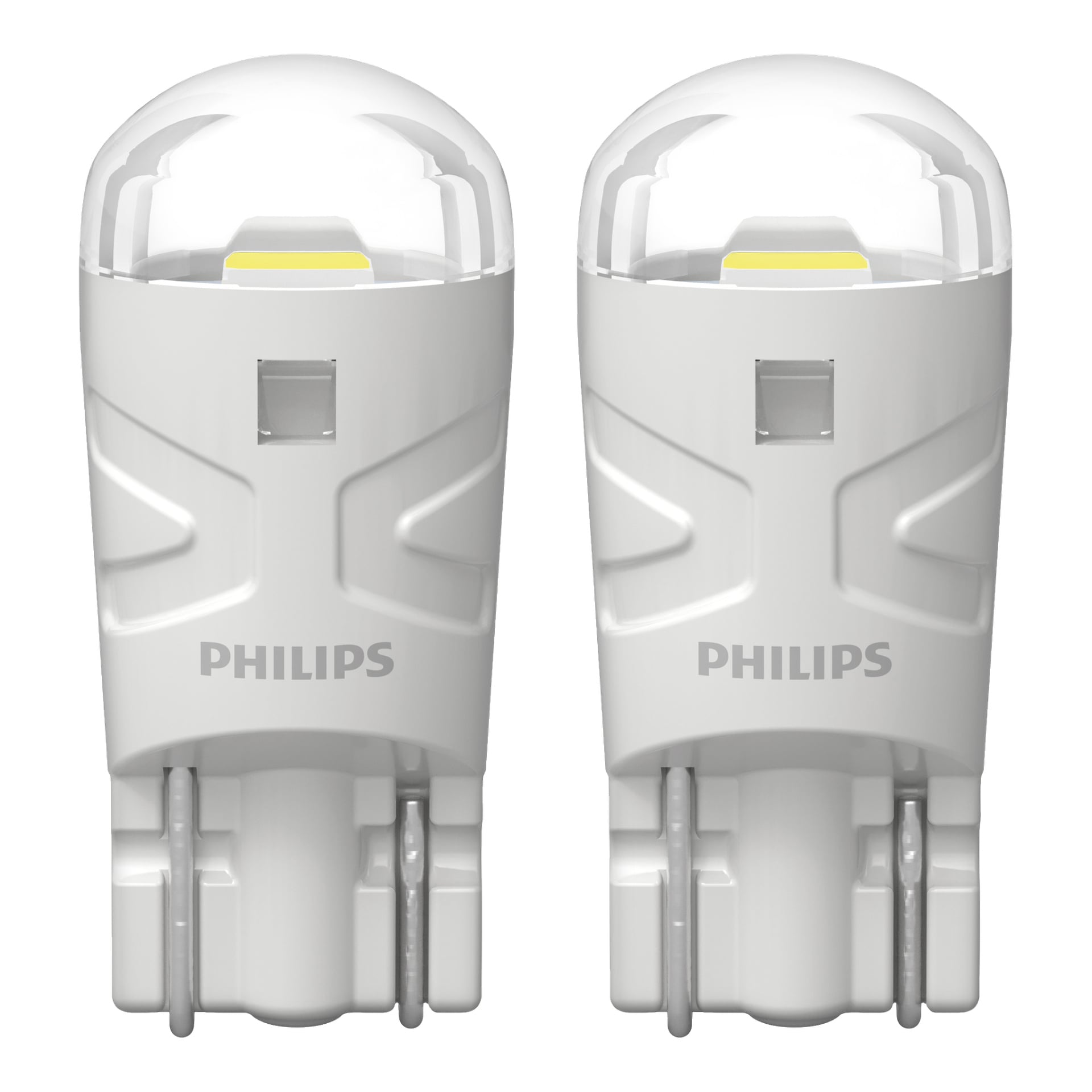 Två Philips Ultinon Pro3100 Signal-lampor visas tillsammans, var och en med en cylindrisk kropp, rundade transparenta toppar och Philips-logotypen på framsidan. Deras elektroniska kontakter är synliga längst ner.