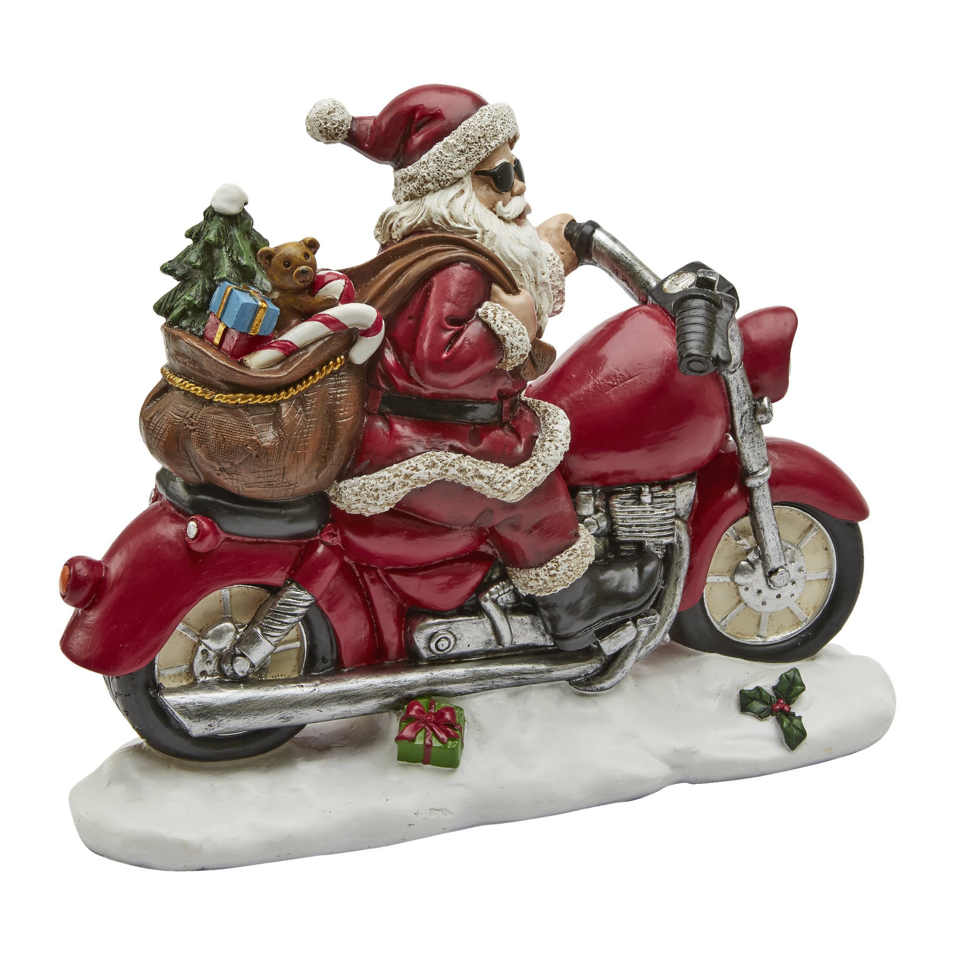 Tomten, med solglasögon, kör en röd motorcykel i EKVIP Santa on Motorbike-figuren. Han har en påse med presenter slängda över ryggen, med saker som en nallebjörn och polkagris synliga, medan mindre inslagna presenter ligger i snön under cykeln.