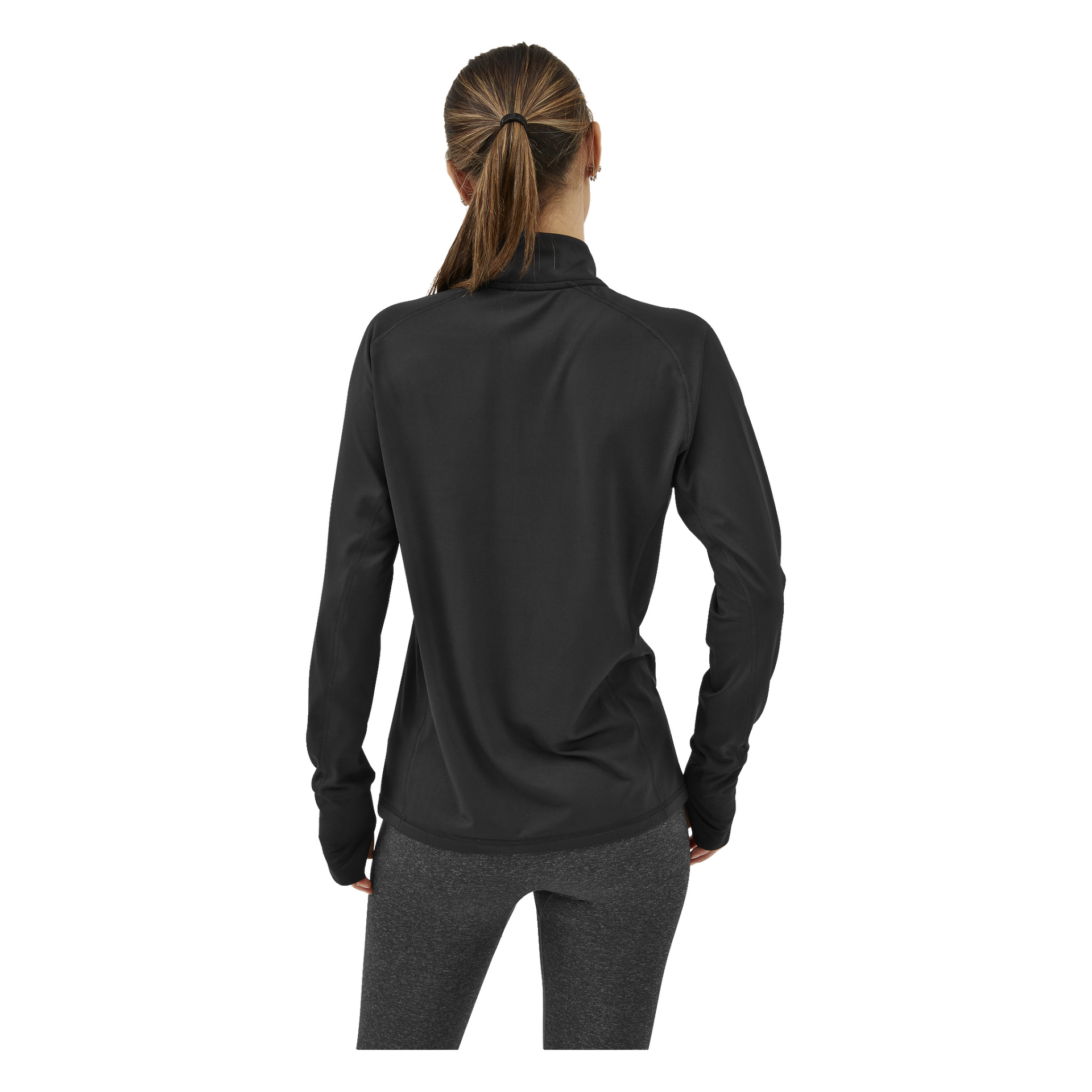 En kvinna med ljusbrunt hår uppsatt i hästsvans står med ryggen mot kameran, klädd i Kayoba Women's Functional Top London och grå och svarta leggings.