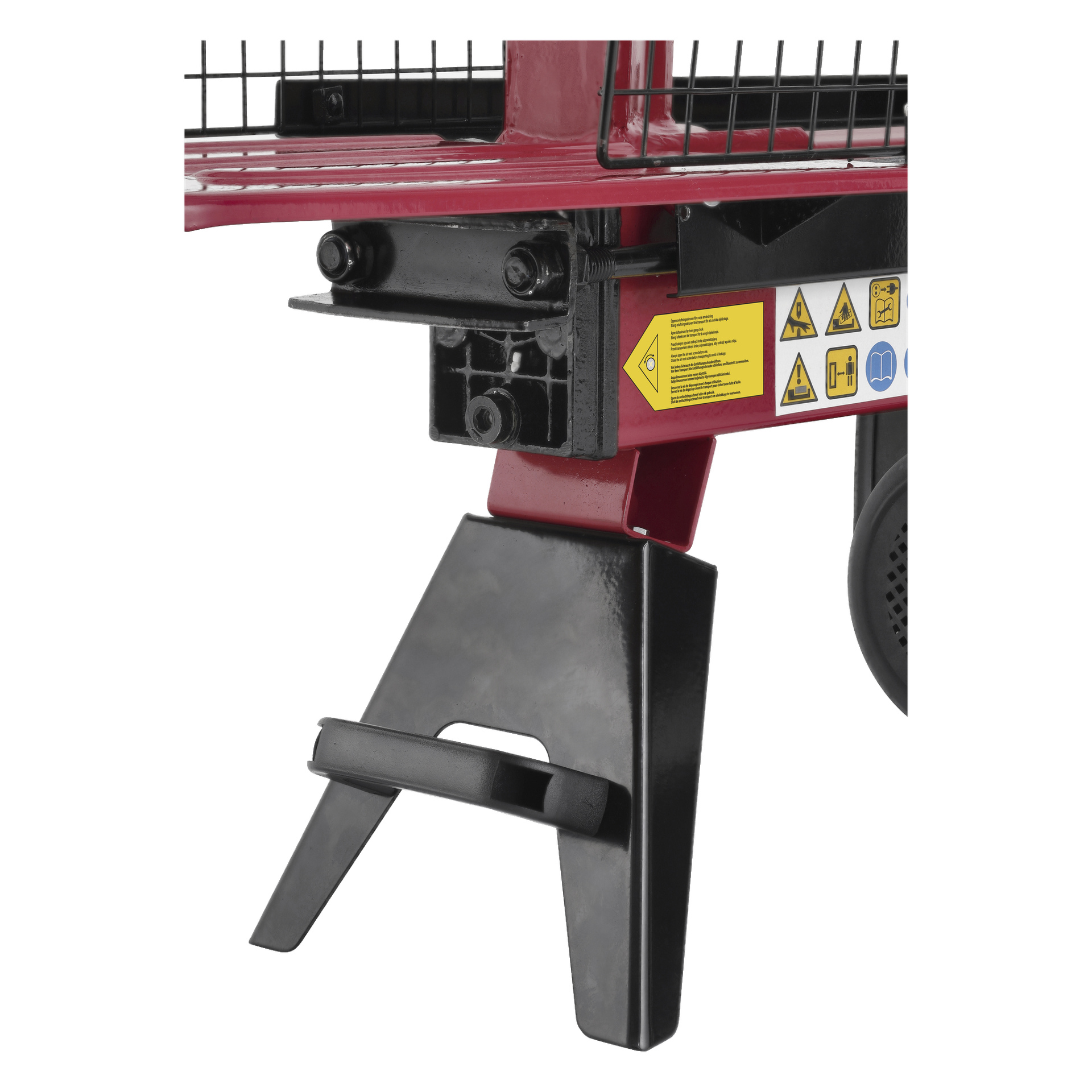 Detaljerad vy av en röd och svart Meec Tools Log Splitter, med flera varningsetiketter, ett kantigt svart stödben, en del av ett hjul på höger sida och omgivande skyddande trådnät.