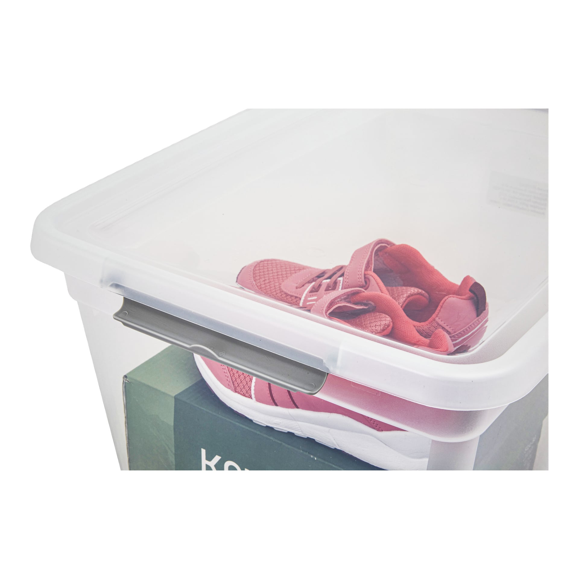 Ein Paar pinke Sportschuhe ruht auf einer grünen Box in einer Hard Head Storage Box mit klarem Kunststoffkörper und durchsichtigem Deckel.