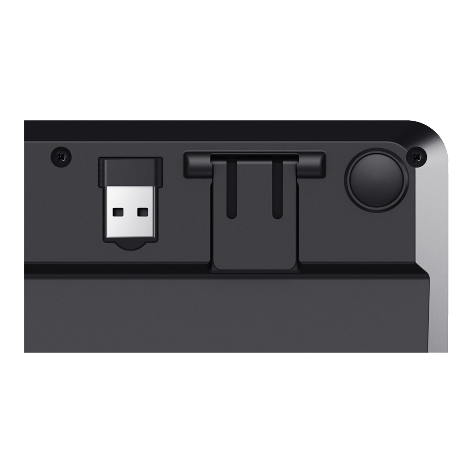 Nærbilde av undersiden av Trust Wireless-tastaturet Ody II, som viser dens USB-trådløse mottaker, sammenleggbar støttebein og en sirkulær gummifot for stabilitet.