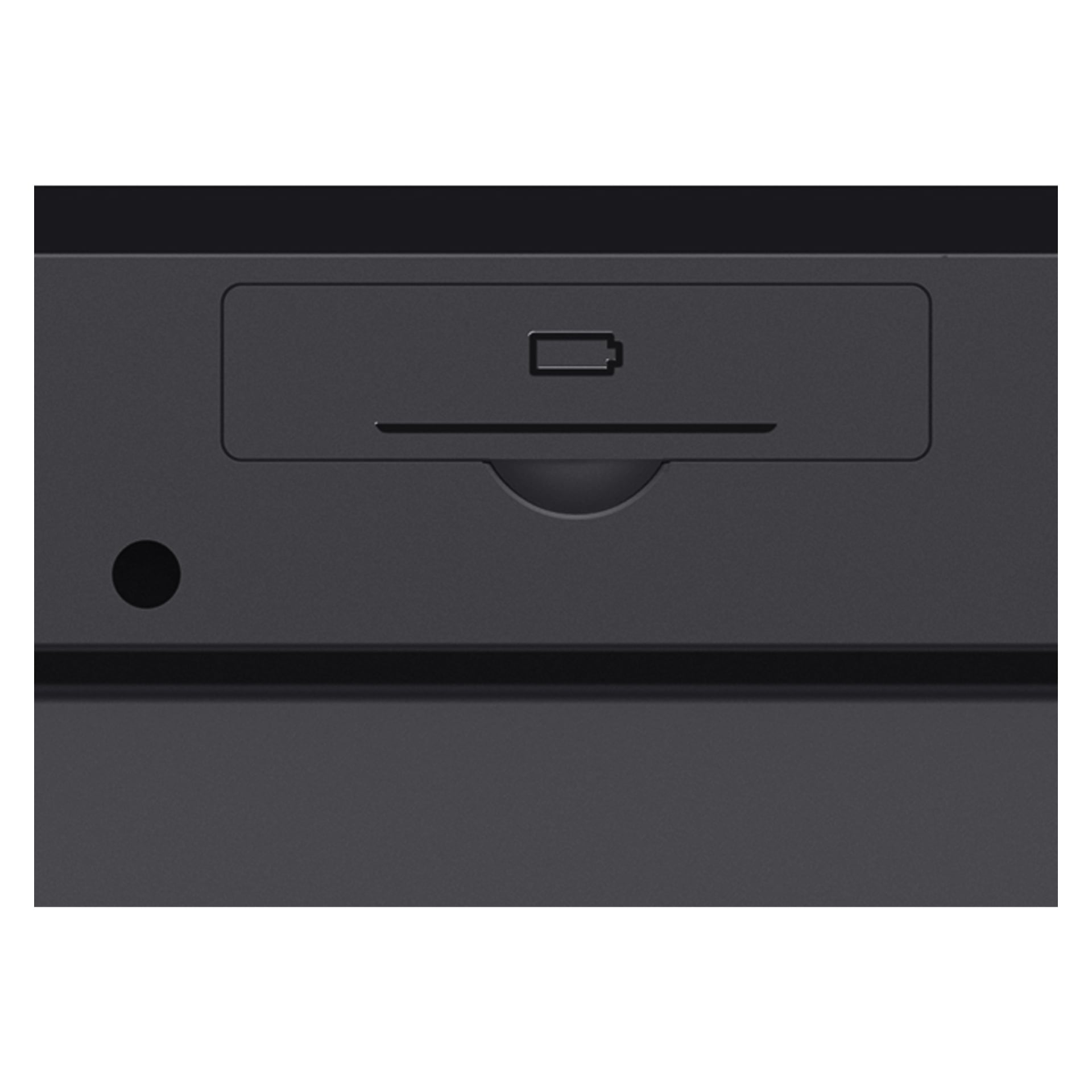 Nærbilde av Trust Wireless-tastaturet Ody II som fremhever en romdør merket med et batteriikon og et sirkulært hull til venstre, mot en mørk bakgrunn.
