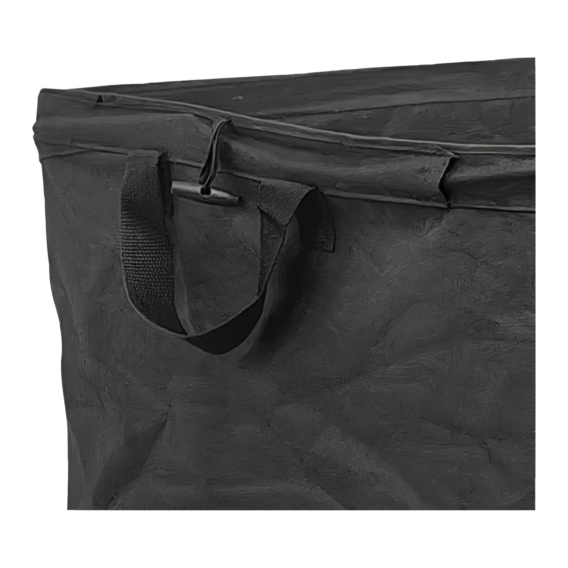 Lähikuva Hard Head Leaf Bag -laukusta näyttää mustan suorakaiteen muotoisen säilytyslaukun, jossa on tukeva kangaskahva ja ylävetoketju. Materiaali näyttää hieman kiiltävältä ja karulta.