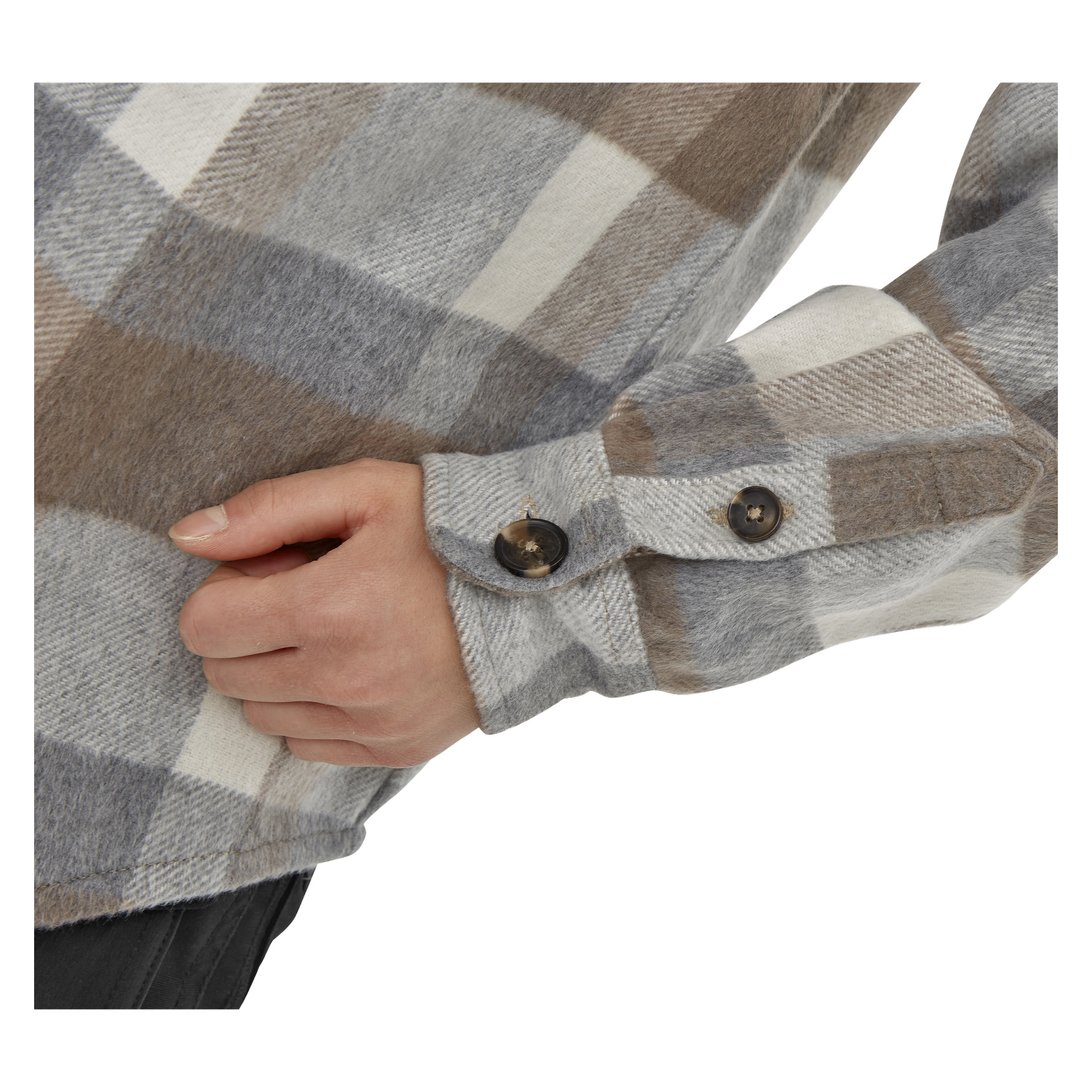 Eine Nahaufnahme zeigt die Hand einer Person, die auf der Hüfte ruht und das Kayoba Outdoor Women's Idhult Overshirt trägt – ein kariertes Flanellhemd mit braunen, grauen und weißen Karomustern. Die mit Knöpfen versehene Manschetten sind zu sehen, zusammen mit einem Teil schwarzer Hosen.