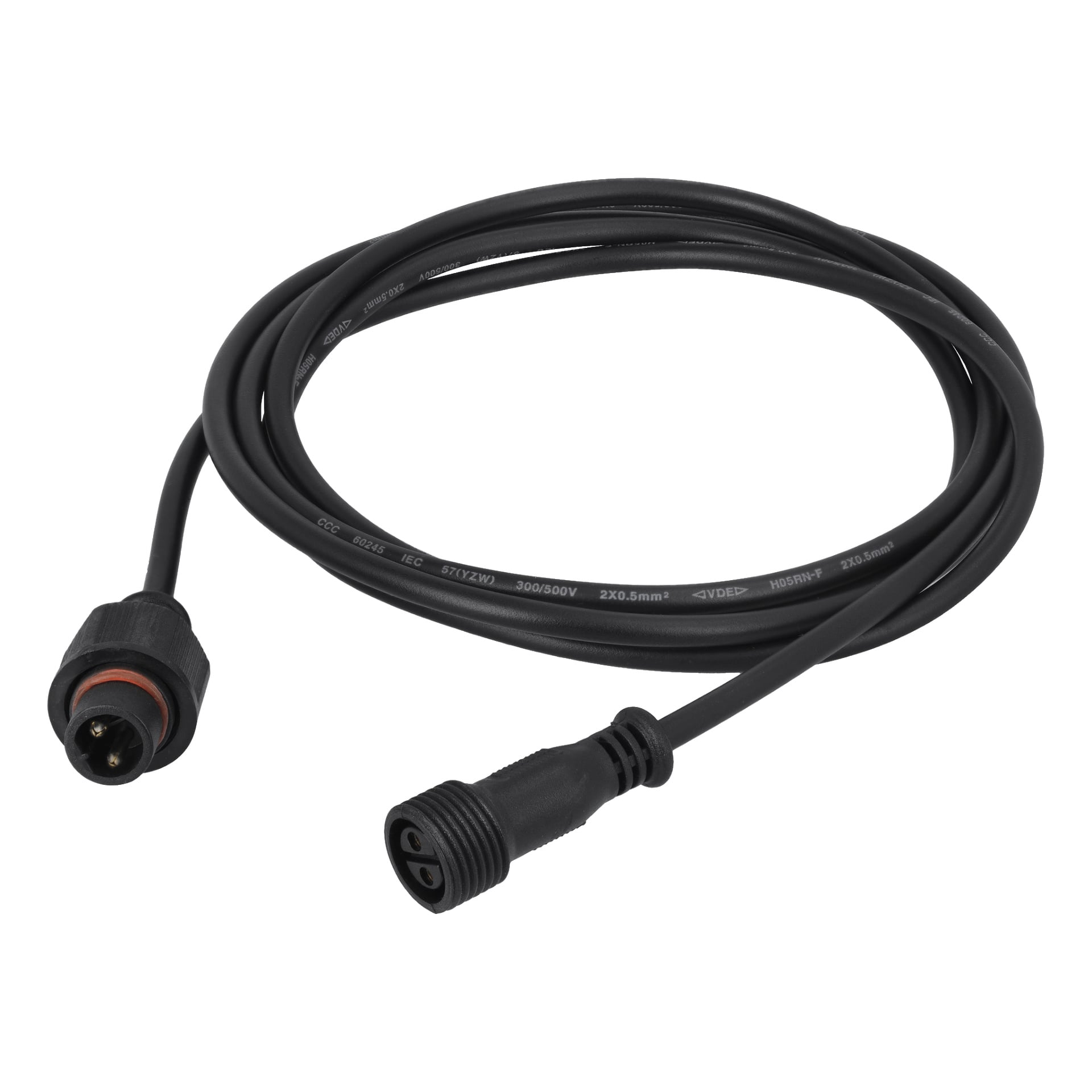 Ansluts Extension Cord Connectable System er en svart kabel med en sirkulær, rillet hannkontakt i den ene enden og en matchende hunnkontakt i den andre, løst rullet.
