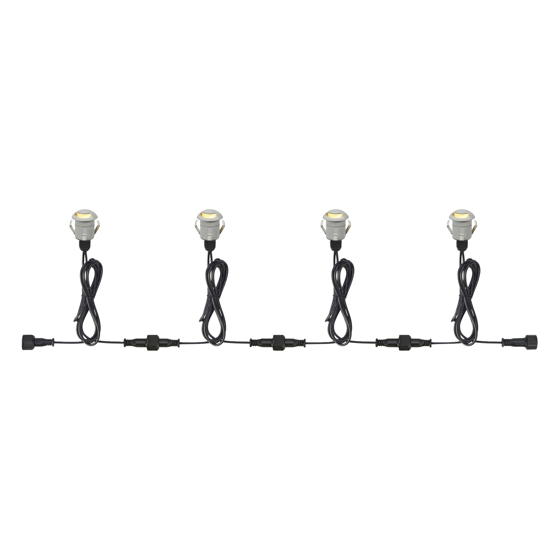 Vier kompakte, runde LED-Leuchten aus dem Anslut Steplights Connectable System sind Ende an Ende mit schwarzen Kabeln verbunden, die in einer geraden Linie angeordnet sind, um zu zeigen, wie sie miteinander verbunden sind.