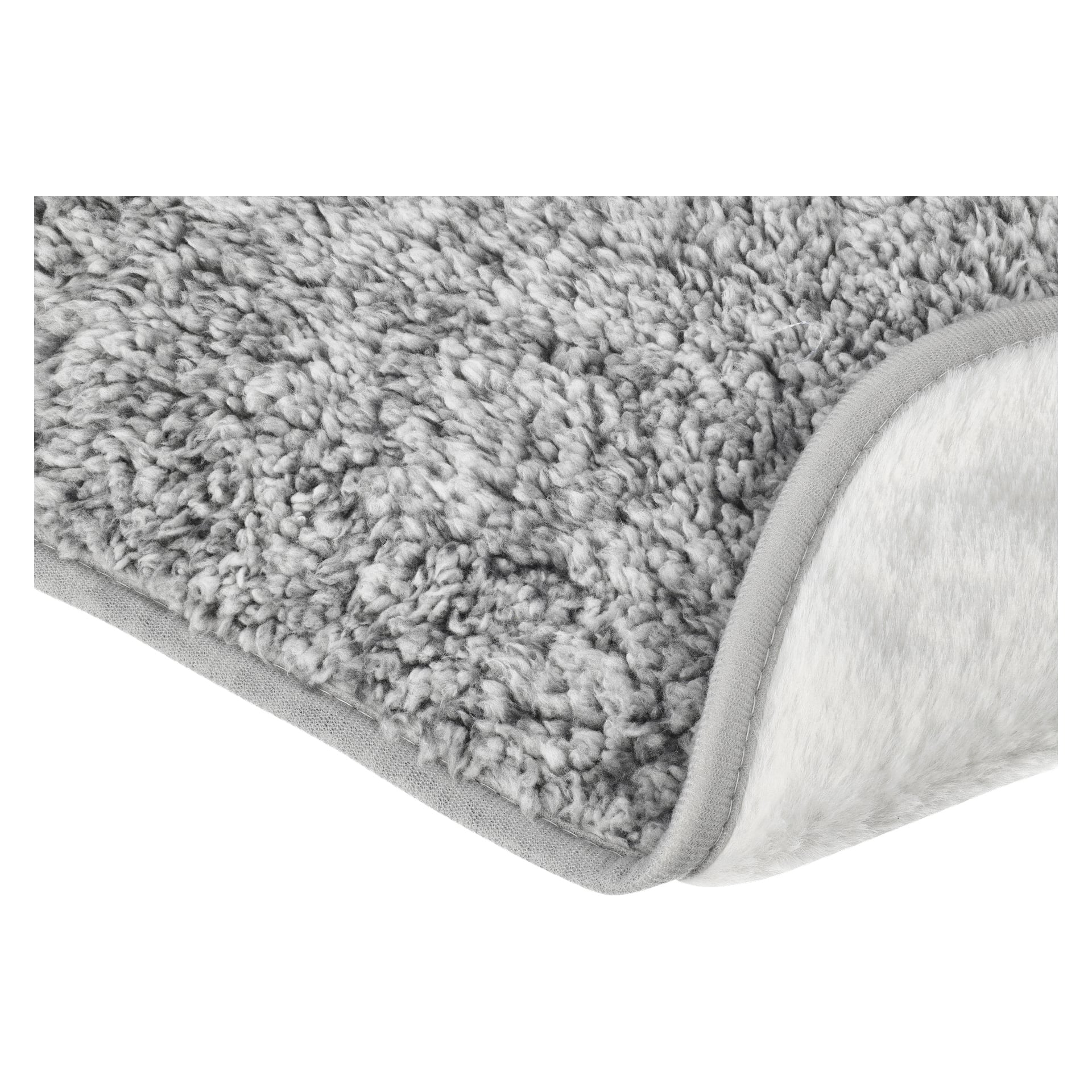 Detaljerad vy av Kayoba Pet Blanket som visar dess grå, texturerade fleece med ett mjukt, mysigt utseende. Ett hörn är vikt bakåt för att visa den släta, ljusare undersidan och den prydligt avslutade grå kanten.