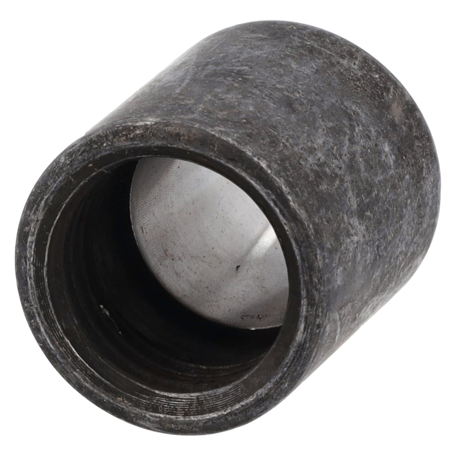 Närbild av en käkkapsel med nitpistol med cylindrisk metallkropp, ihålig mittpunkt och synligt sliten, texturerad yta.