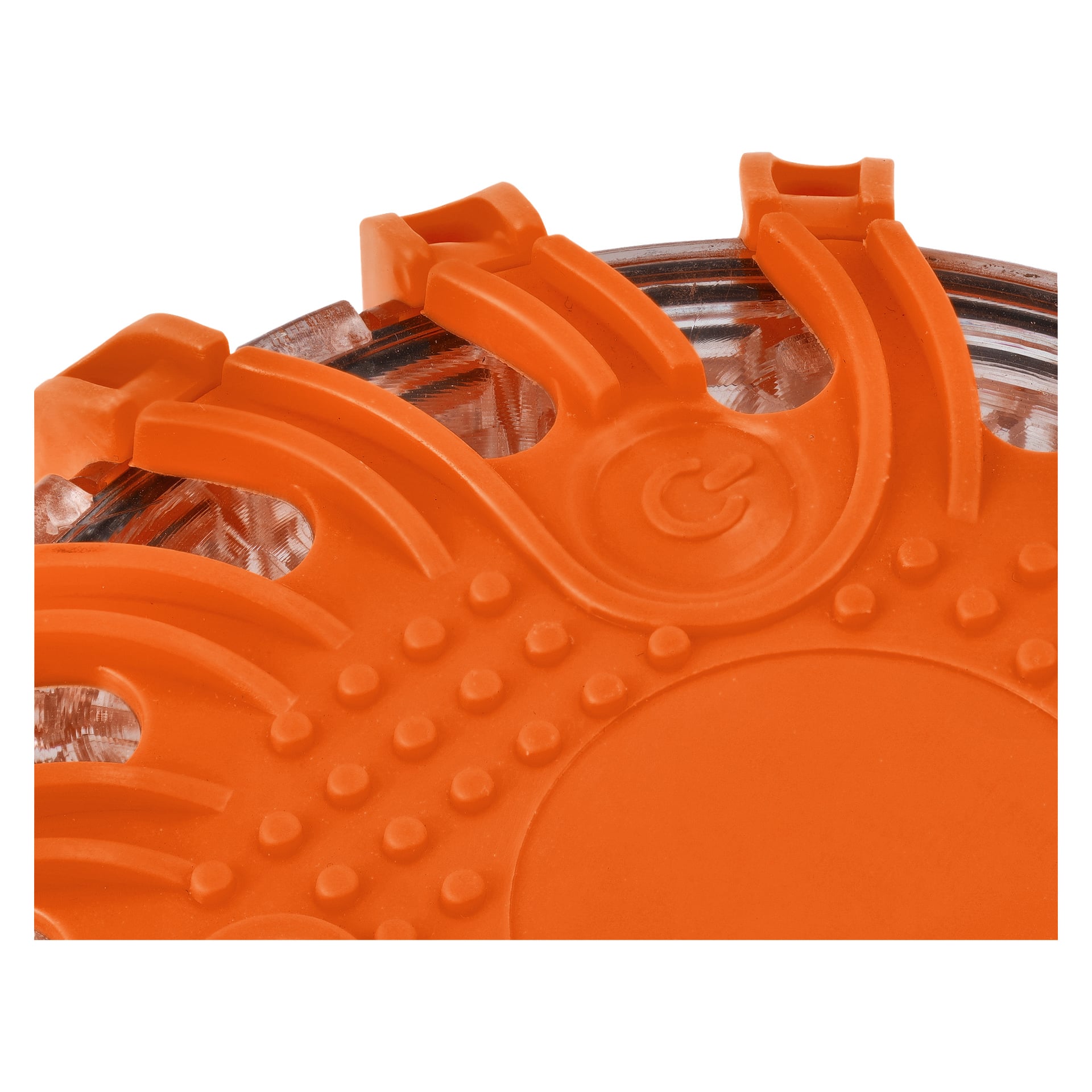 Lähikuva Hamron Rechargeable Warning Puck LEDistä, oranssista muovilaitteesta, jossa on näkyvät kaarevat harjanteet ja sarja pyöreitä kuvioita. Läpinäkyvä osa mahdollistaa näkymän sisäosiin, ja voimasymboli on muotoiltu lähelle keskustaa.
