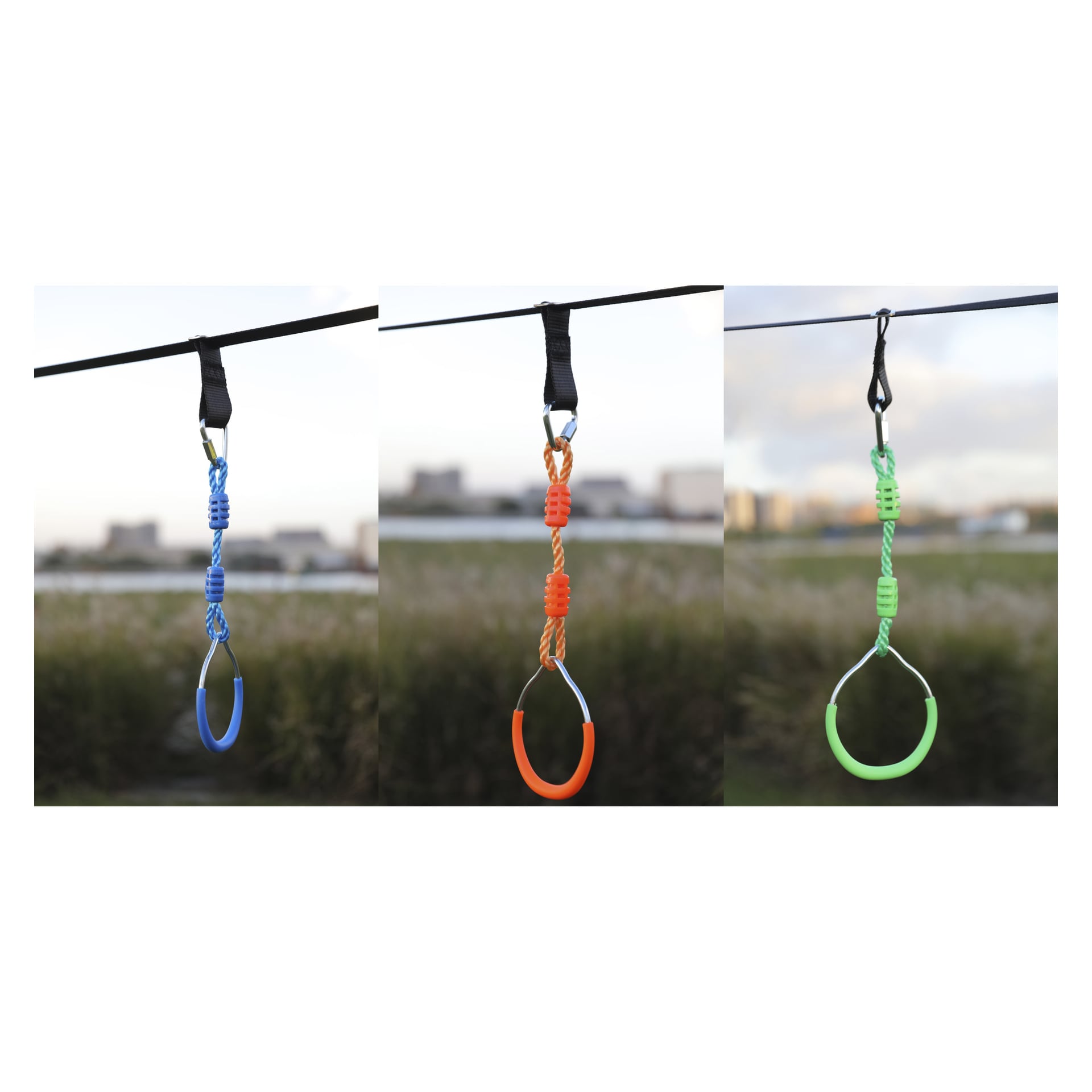 Lähikuvia Kayoban 13-osaisesta Slackline-setistä, jossa on oranssit, punaiset ja vihreät säädettävät renkaat mustilla remmeillä; Ruohoinen pelto takana.