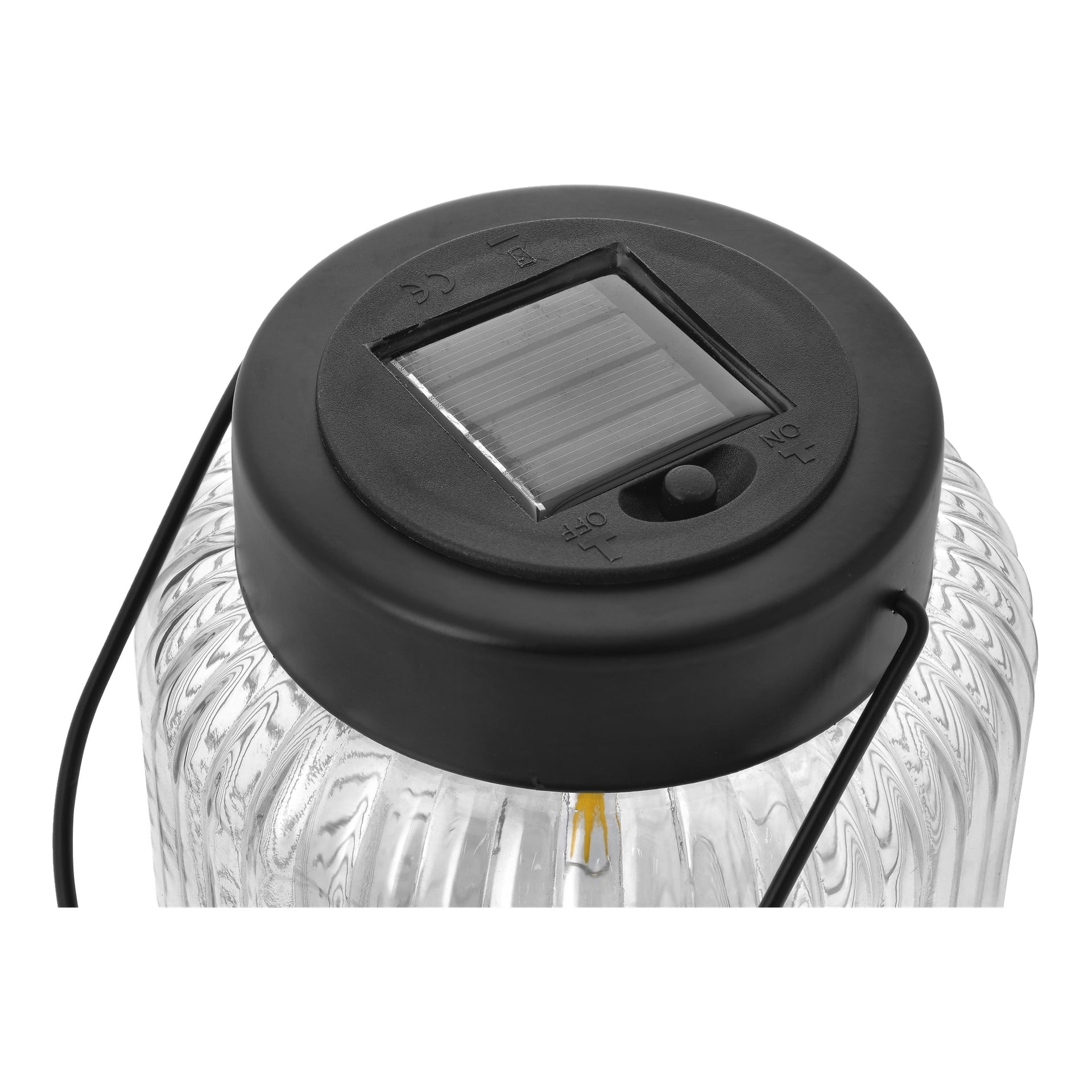 Nærbilde av Anslut LED solcellelykt, med svart solcellepanellokk, av/på-bryter, metallhåndtak og ribbet glasskrukke.