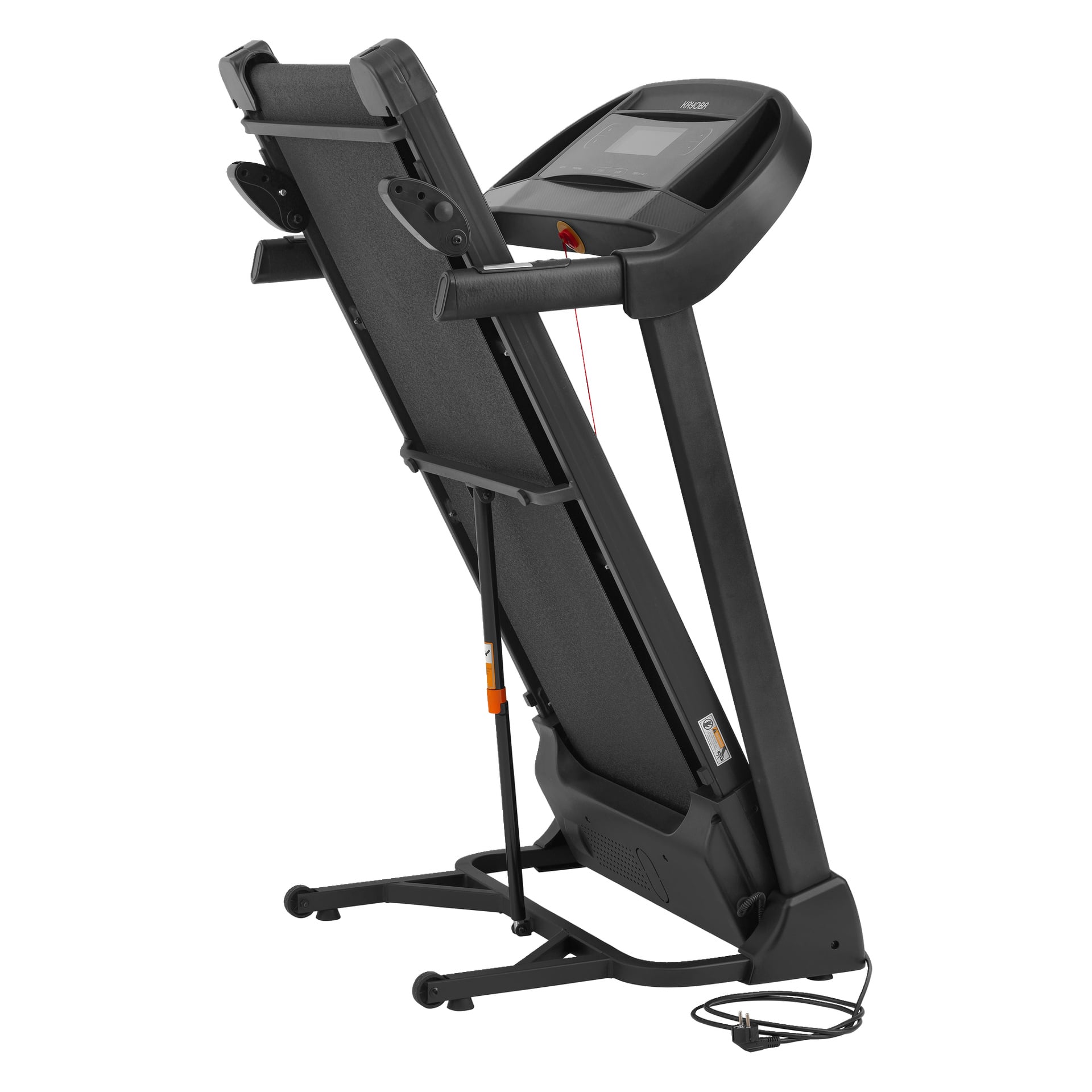 Kayoba Treadmill foldet seg oppreist, sikkerhetslåsen synlig, kontrollpanelet øverst, strømkabelen hvilende nær basen.