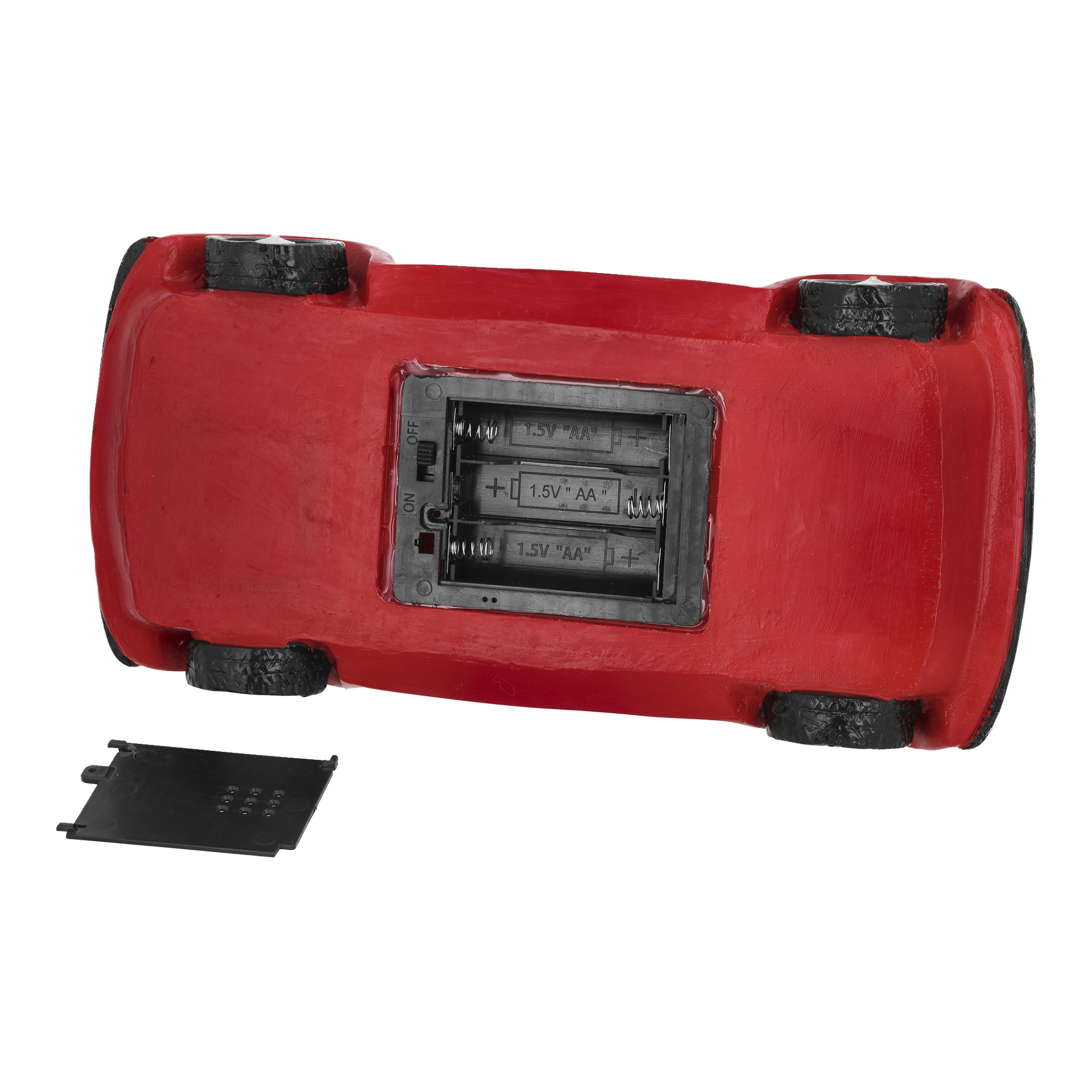 En upp-och-nedvänd EKVIP Tomte-bil med röda LED-lampor blottar sin öppna batteriplats för tre AA-batterier och locket i närheten.