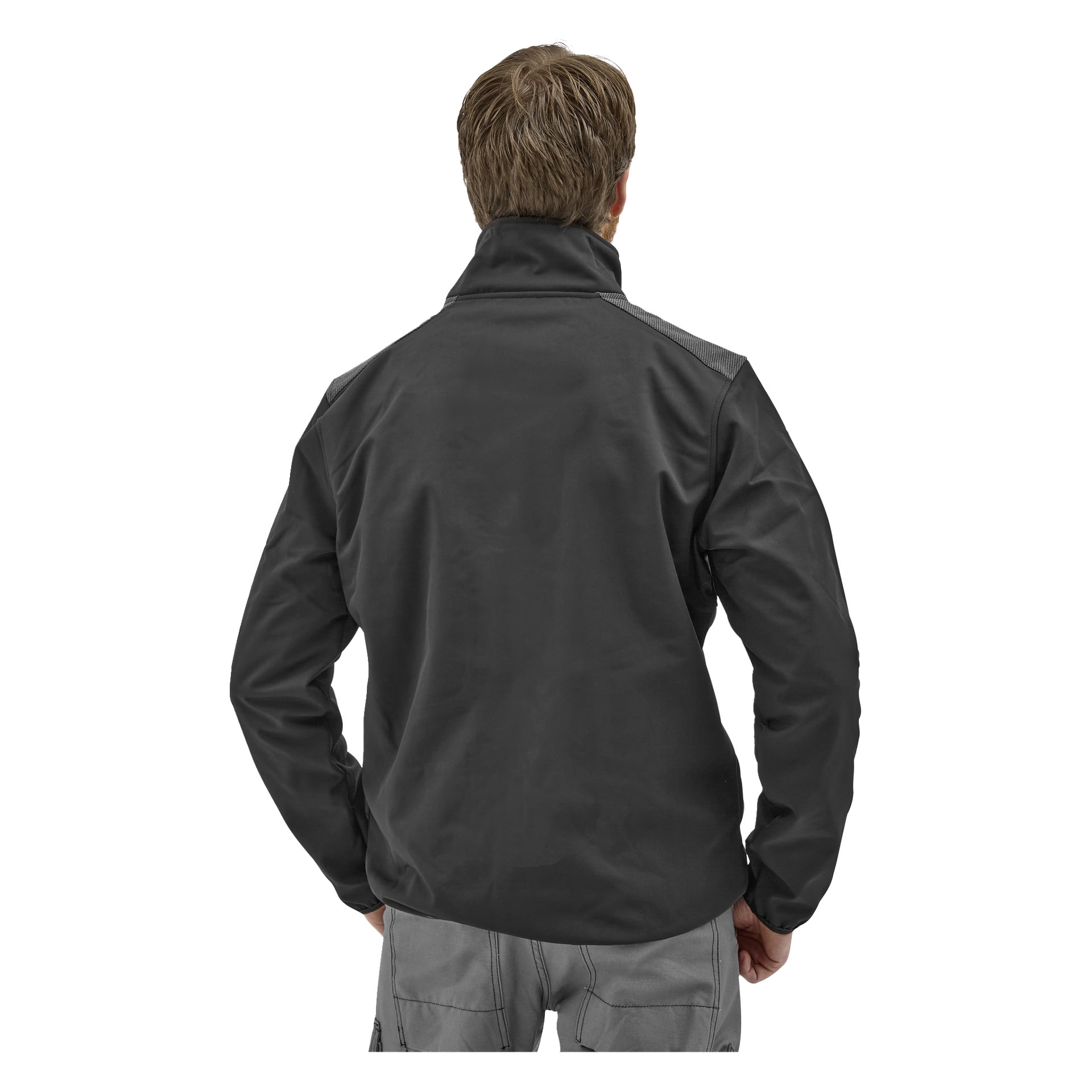 En person med kort lysebrunt hår står med ryggen til, iført en mørkegrå Bluewear softshell-jakke for menn Simon og lysegrå bukser.