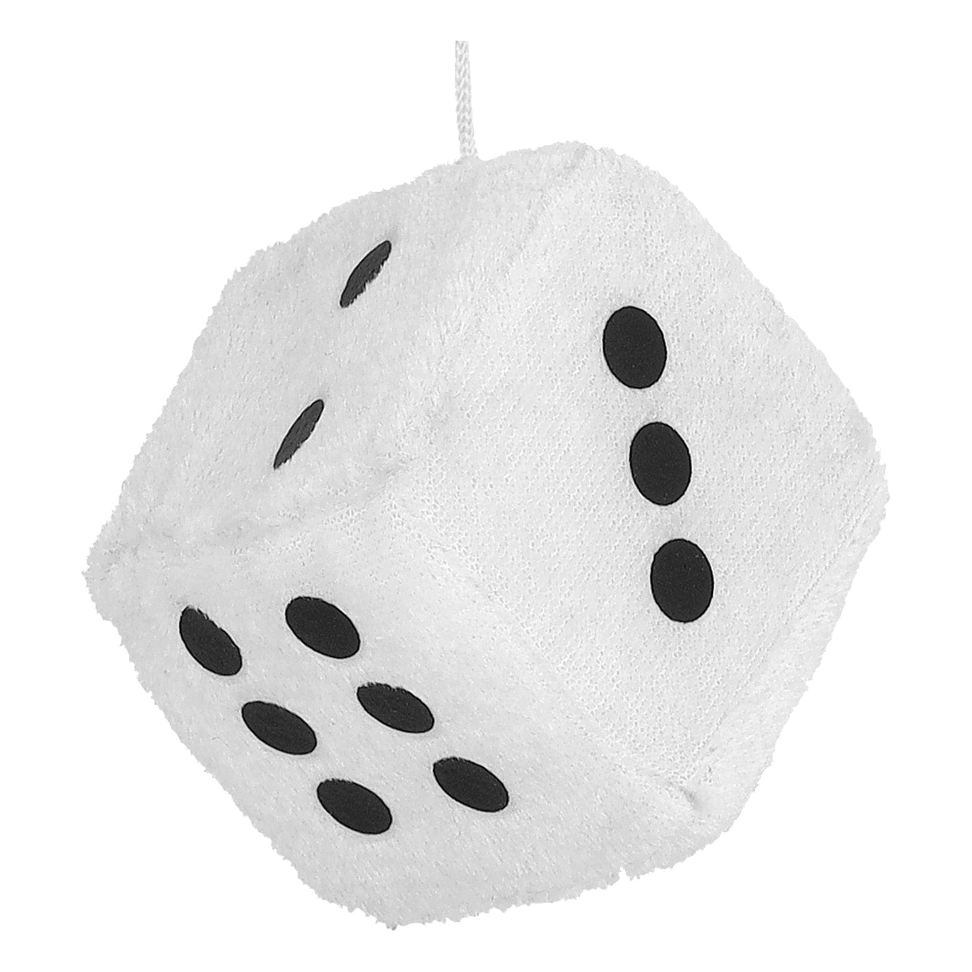 En mjuk vit tärning med svarta prickar hänger från ett vitt snöre och visar sidor med fem, tre och sex prickar.