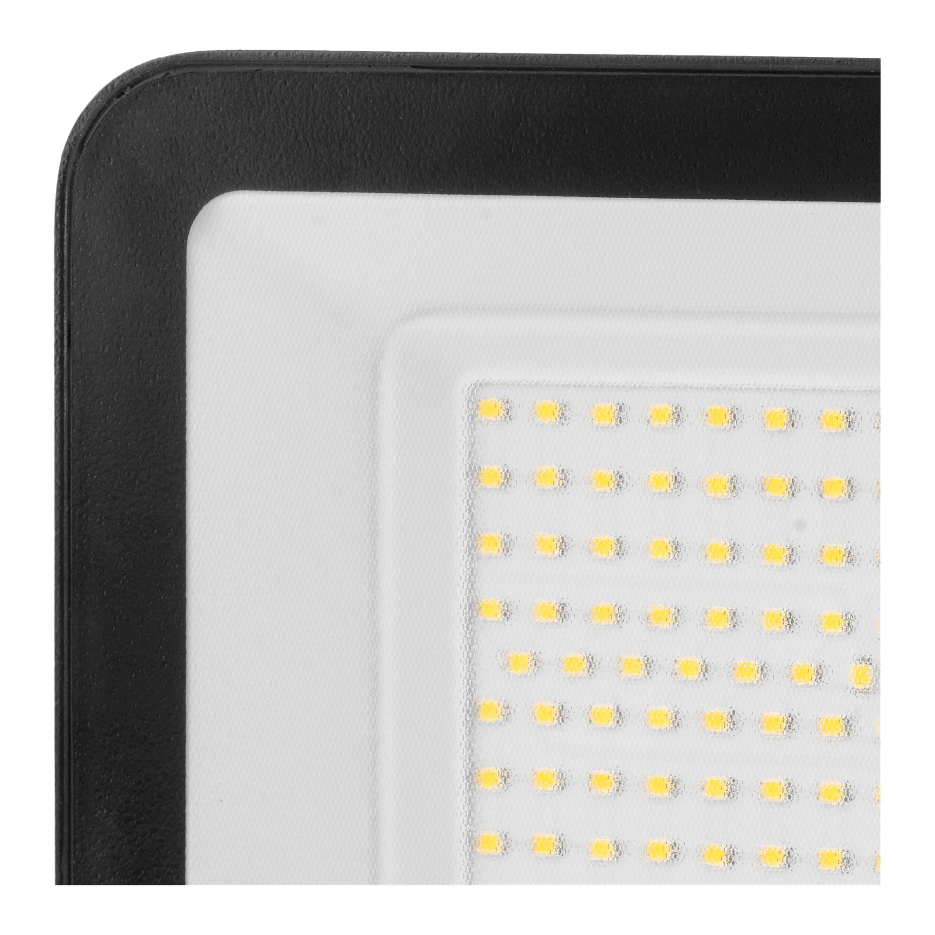 Nærbilde av et Anslut LED-flomlys øverst til venstre, som fremhever den svarte rammen og det hvite panelet med gule LED-rader.