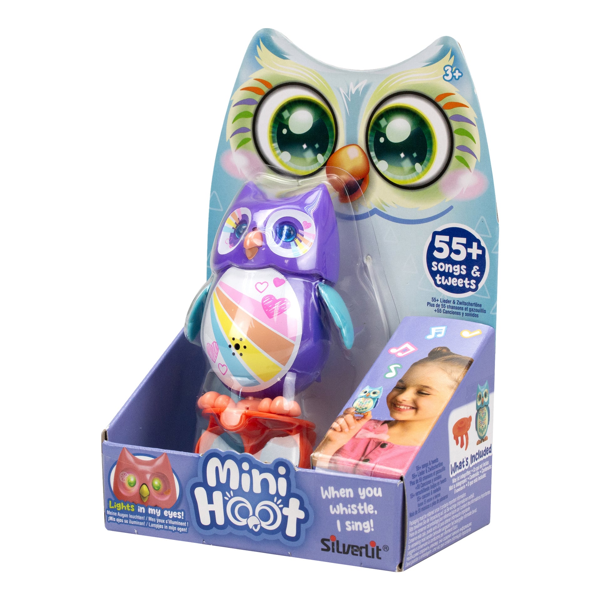 Leksaksuggla Mini Hoot från Silverlit i lila med regnbågsrandig mage, visad i förpackning med ett illustrerat uggleansikte. På lådan står det "55+ låtar", "tweetljud" och "lysande funktioner".
