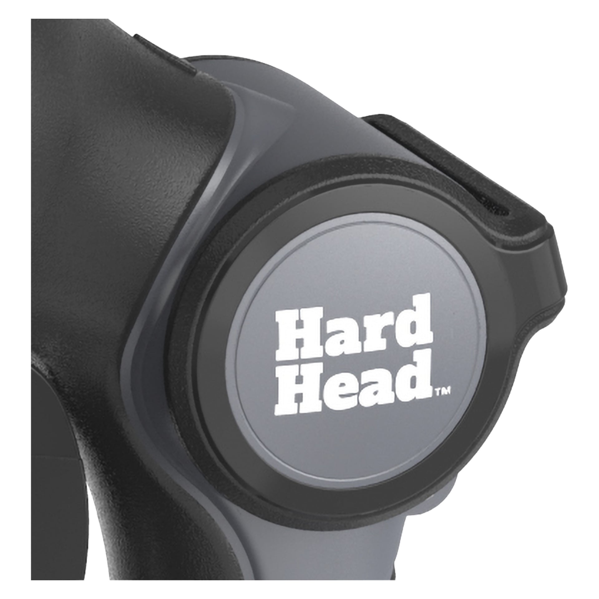 En närbild på ett grått sprinklermunstycke med en rund lock som visar "Hard Head"-logotypen; området runt omkring består av svart och grå plast.