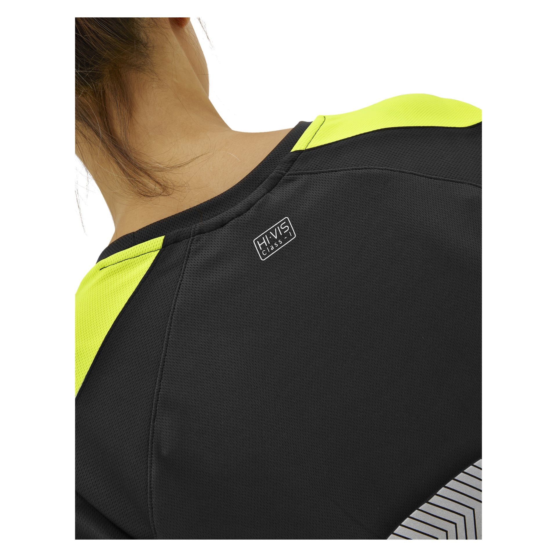 Närbild på en persons övre rygg i en Bluewear Hi-Vis Lytton-skjorta med gula detaljer; Etiketten säger HI-VIS KLASS 1, hår synligt.
