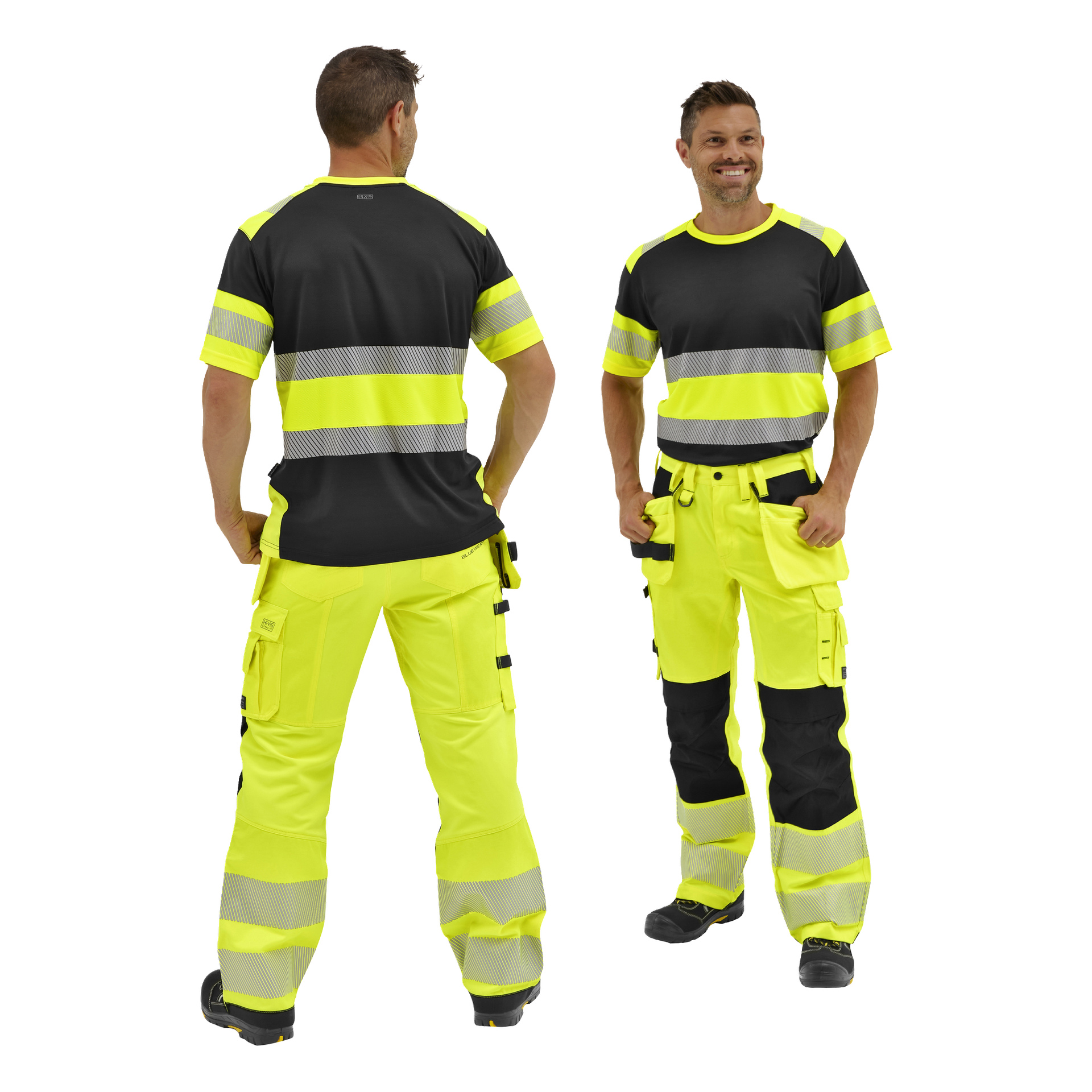 Två män i matchande gul-svarta skjortor och Bluewear Hi-Vis Trousers Rex med reflekterande ränder; en vänd framåt, en bakåt.