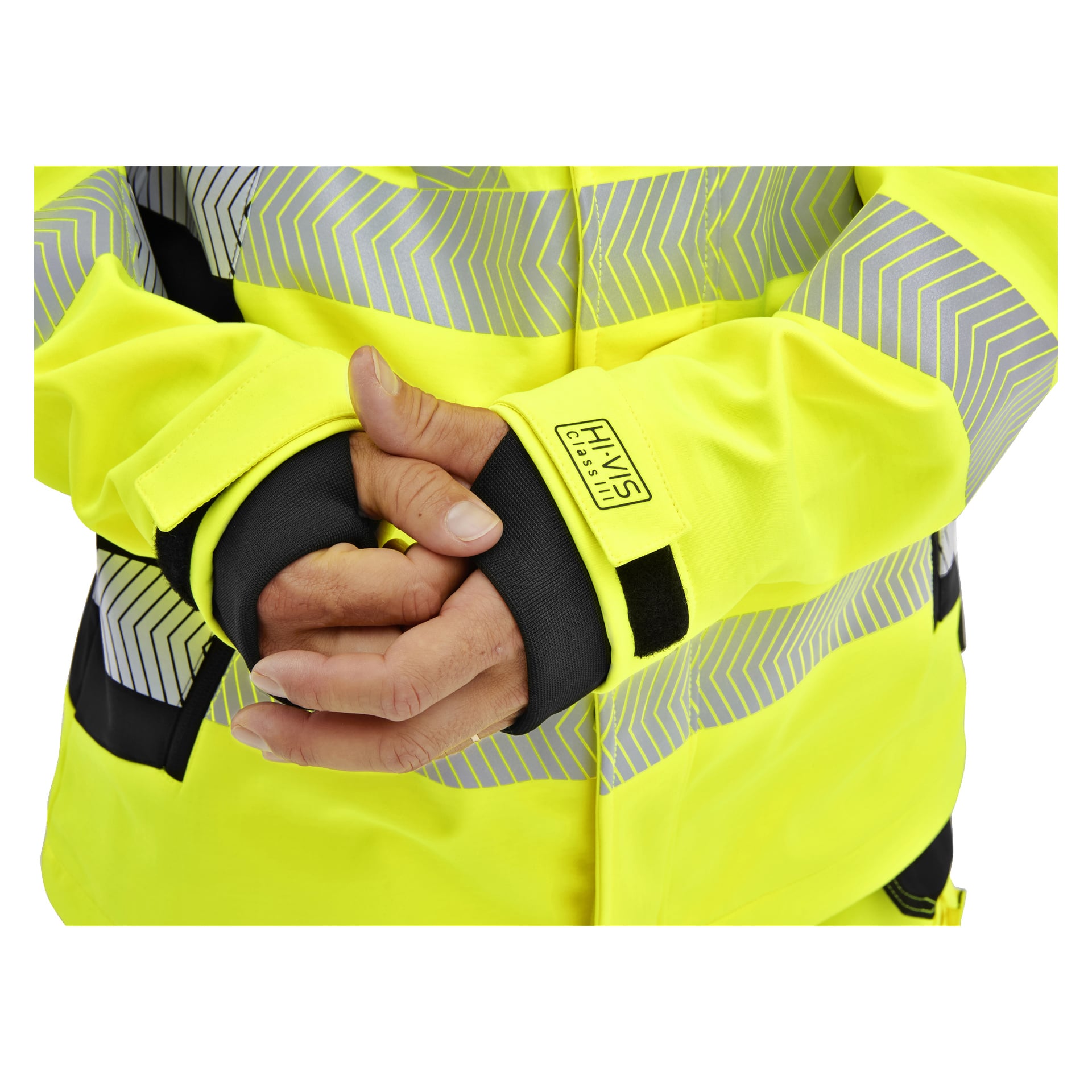 En person i en Bluewear Hi-Vis Kingston softshelljacka med reflekterande ränder knäpper sina handleder och visar svarta ärmar med tumhål.