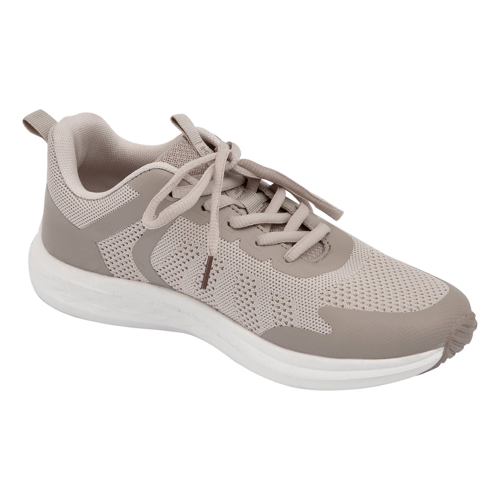 Beige joggesko med nettingpaneler, hvit såle, beige lisser og en lav stil, vinklet for å vise både side og topp.