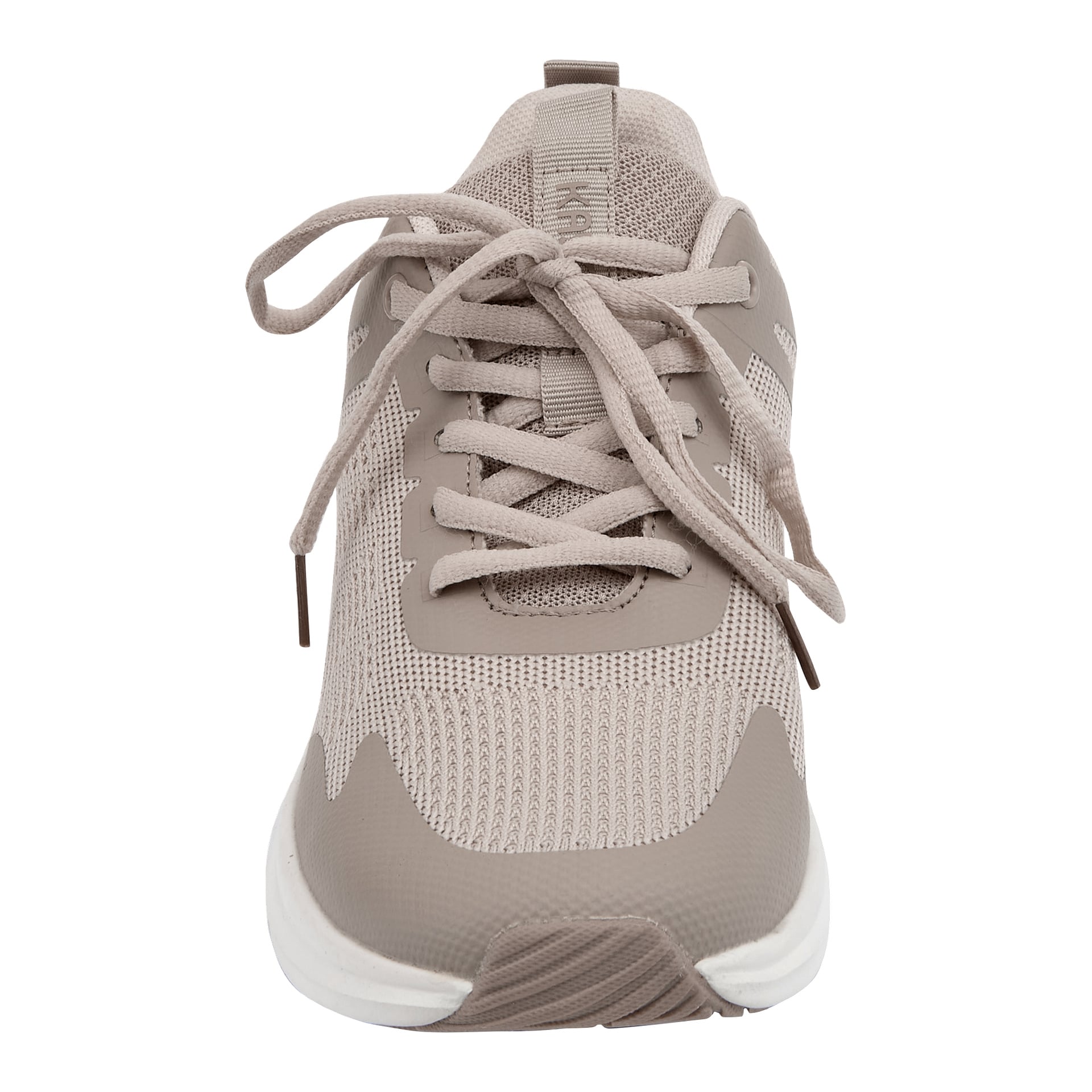 Sett forfra av en beige joggesko med nettingoverdel, lisser og en hvit såle fremhevet av beige detaljer.