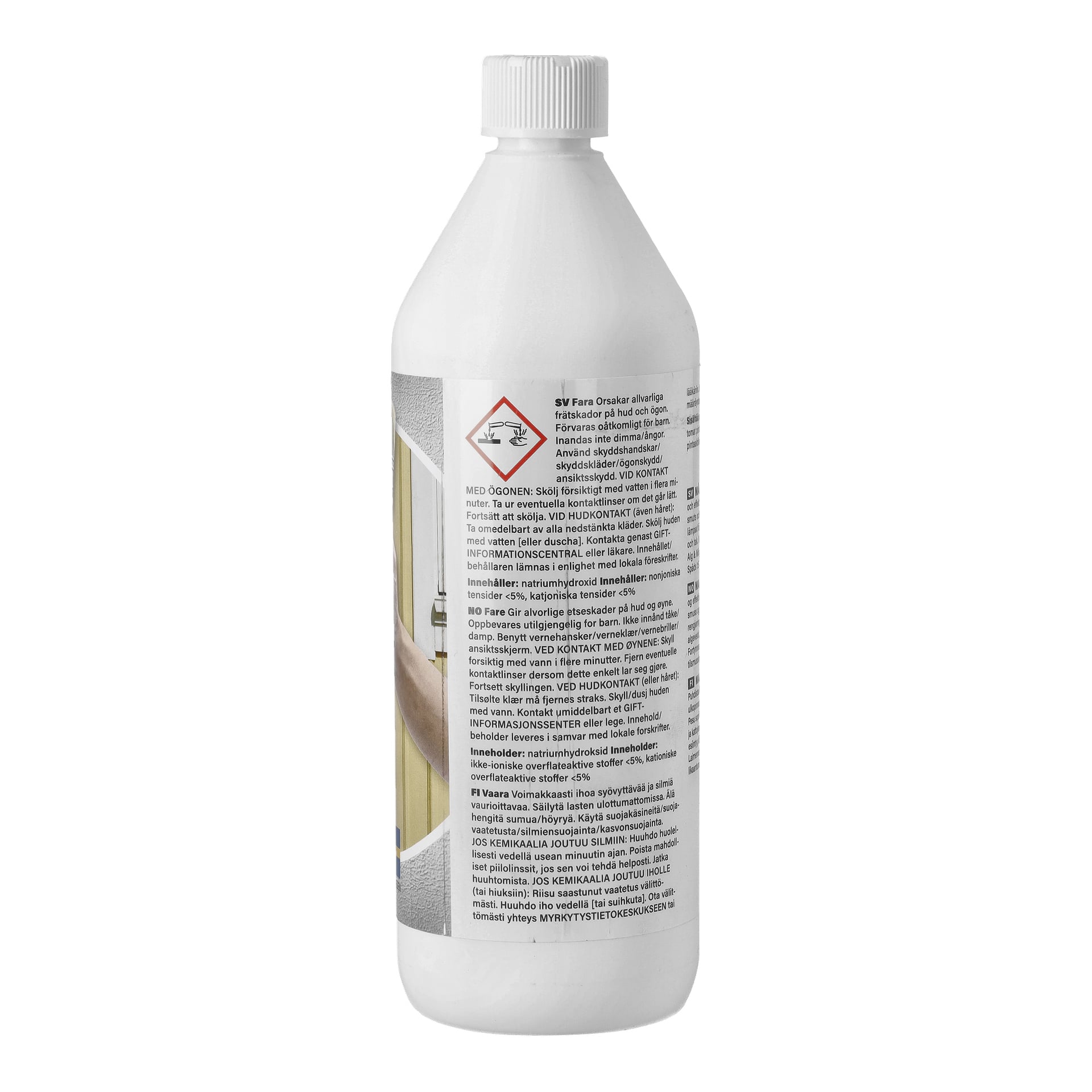 En vit plastflaska med spetsig lock visar en varningssymbol och varningstext. En hand med handske och en vägg syns till vänster.