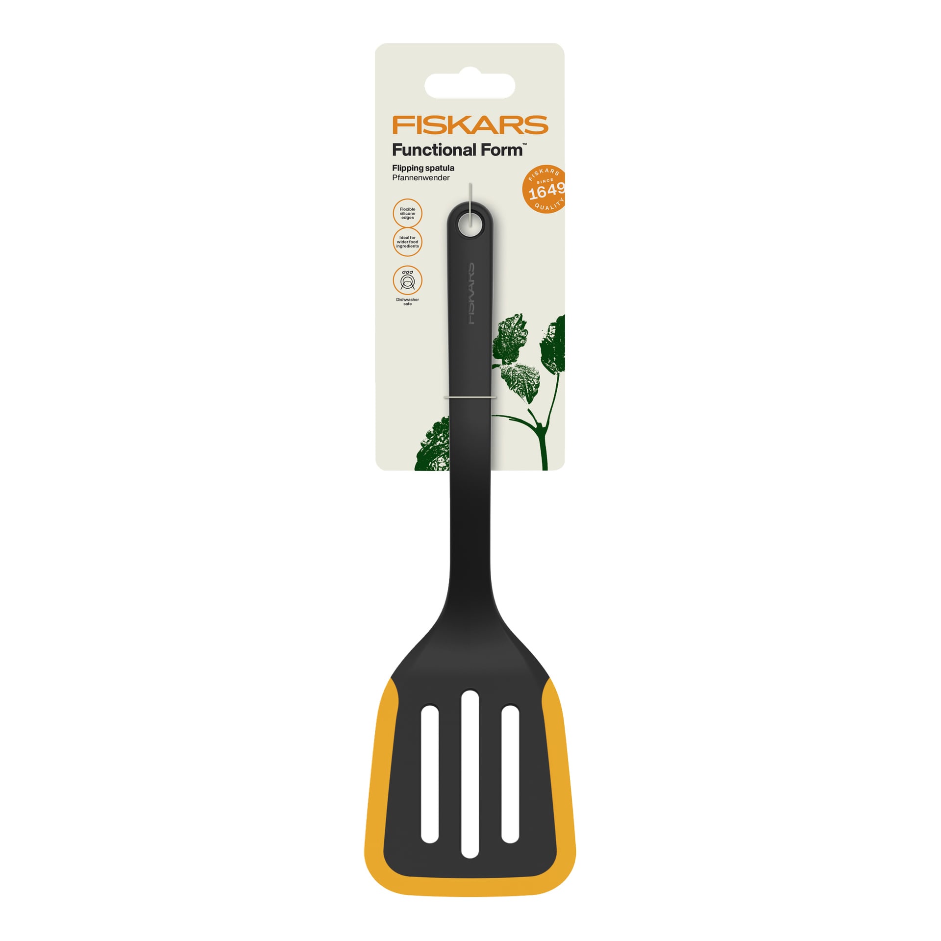 Czarno-żółta Functional Form Patuła Fiskars z obrotową łopatką w opakowaniu, wyeksponowana z informacjami o produkcie i liściastymi grafikami za nią.