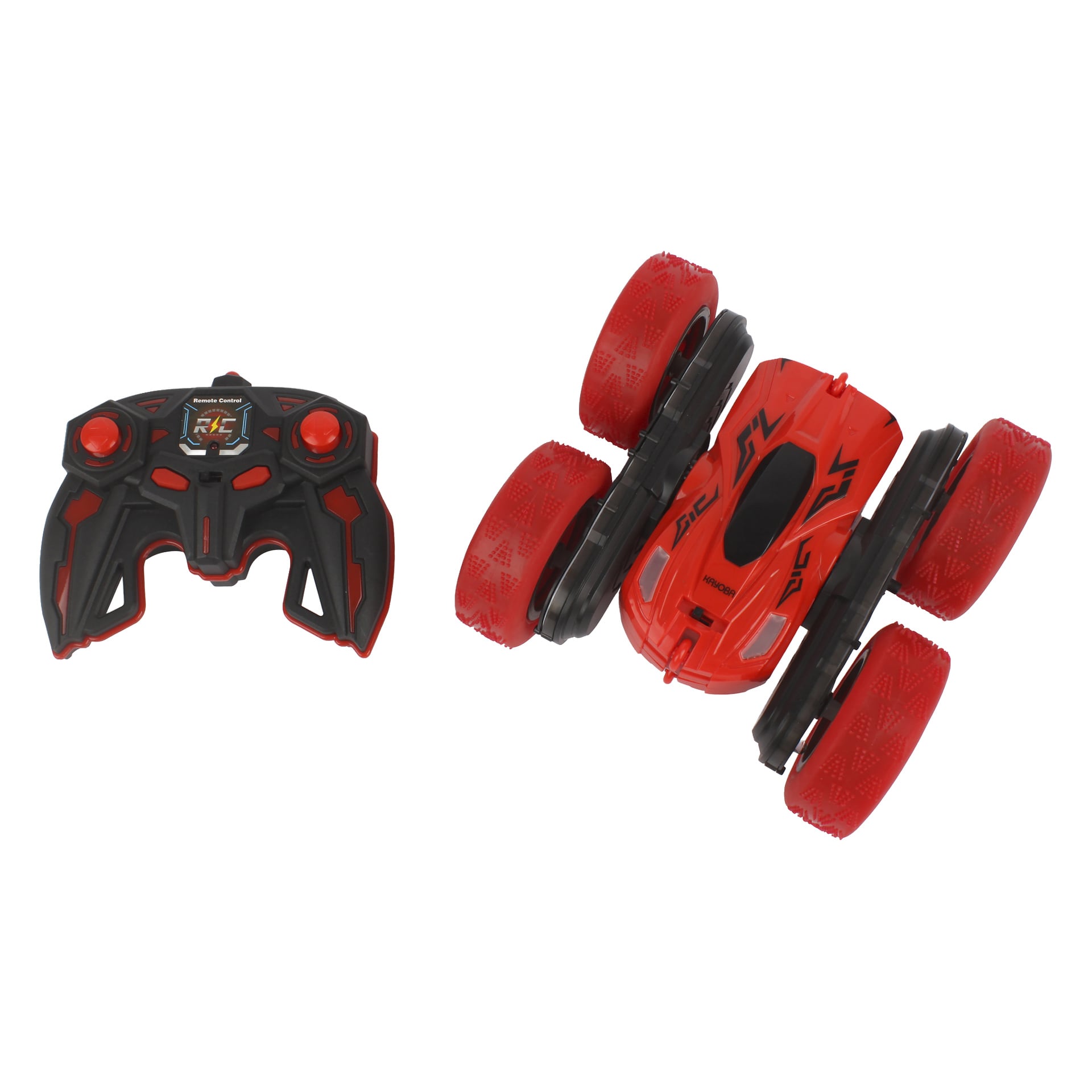 En röd och svart RC-leksaksbil med stora hjul står bredvid en svart och blå kontroll med två joysticks och flera knappar.