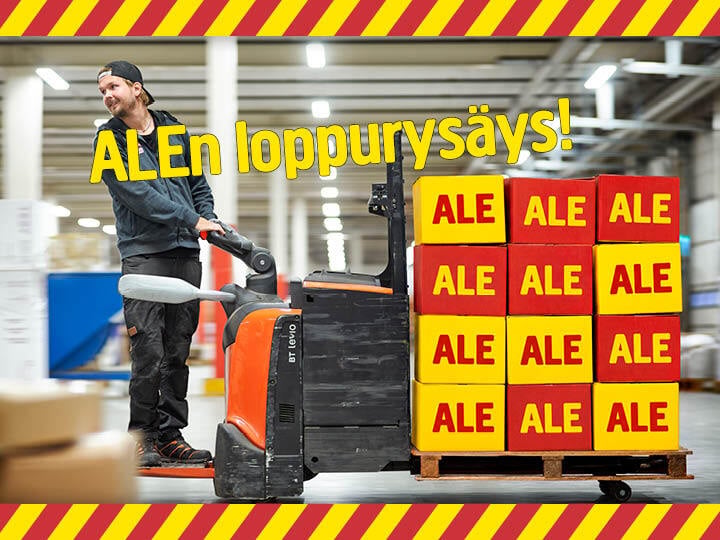 Mies siirtää ALE-merkittyjä laatikoita varastossa käsikäyttöisellä pumppukärryllä. Kuvan yläosassa lukee ”ALEn loppurysäys!”, ja kuvaa kehystää kelta-punaraitainen varoitusreunus.
